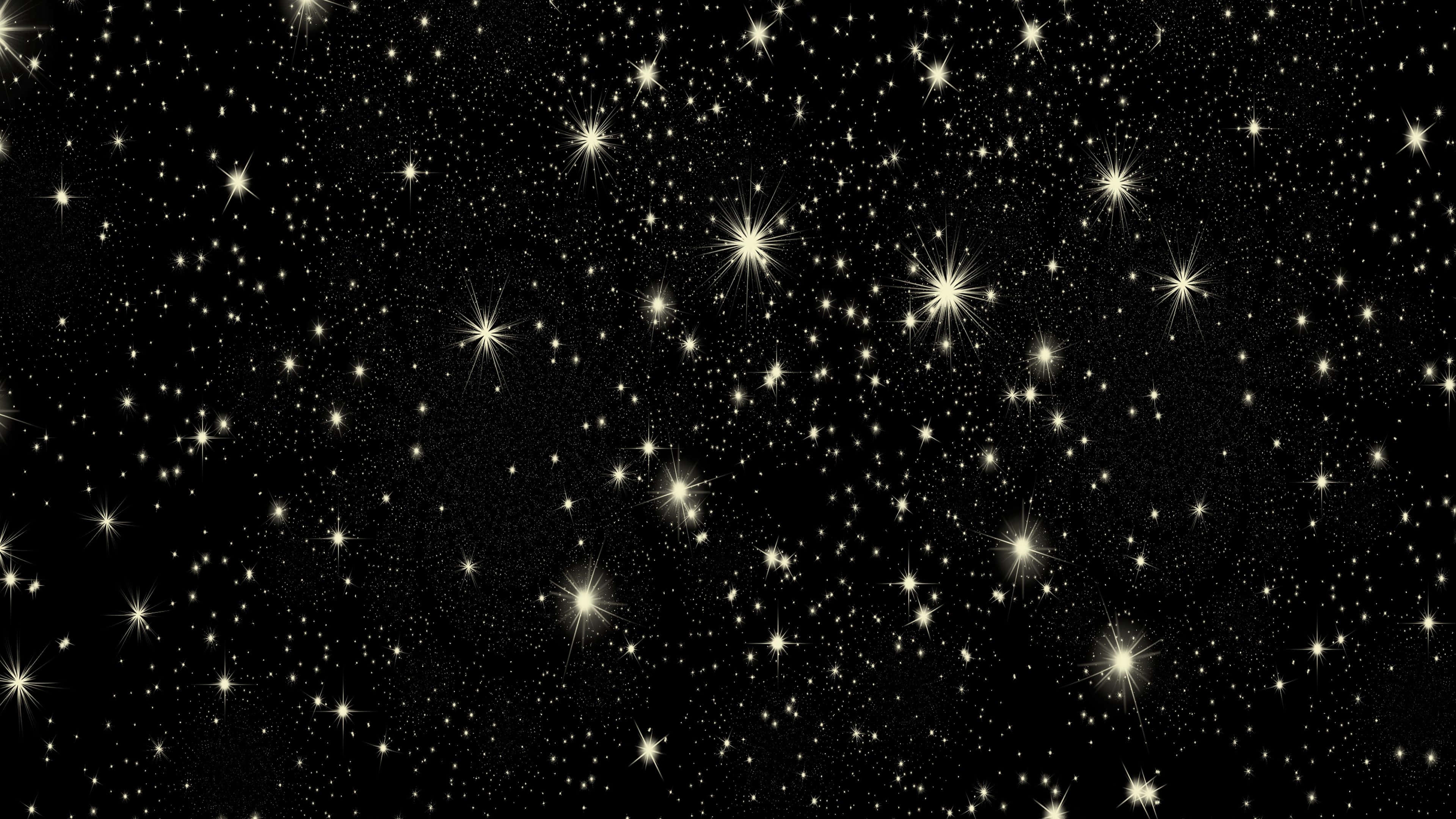 Starry 桌布 壁紙 — 廣闊的閃爍金色星星散落在深邃的黑色宇宙空間中。