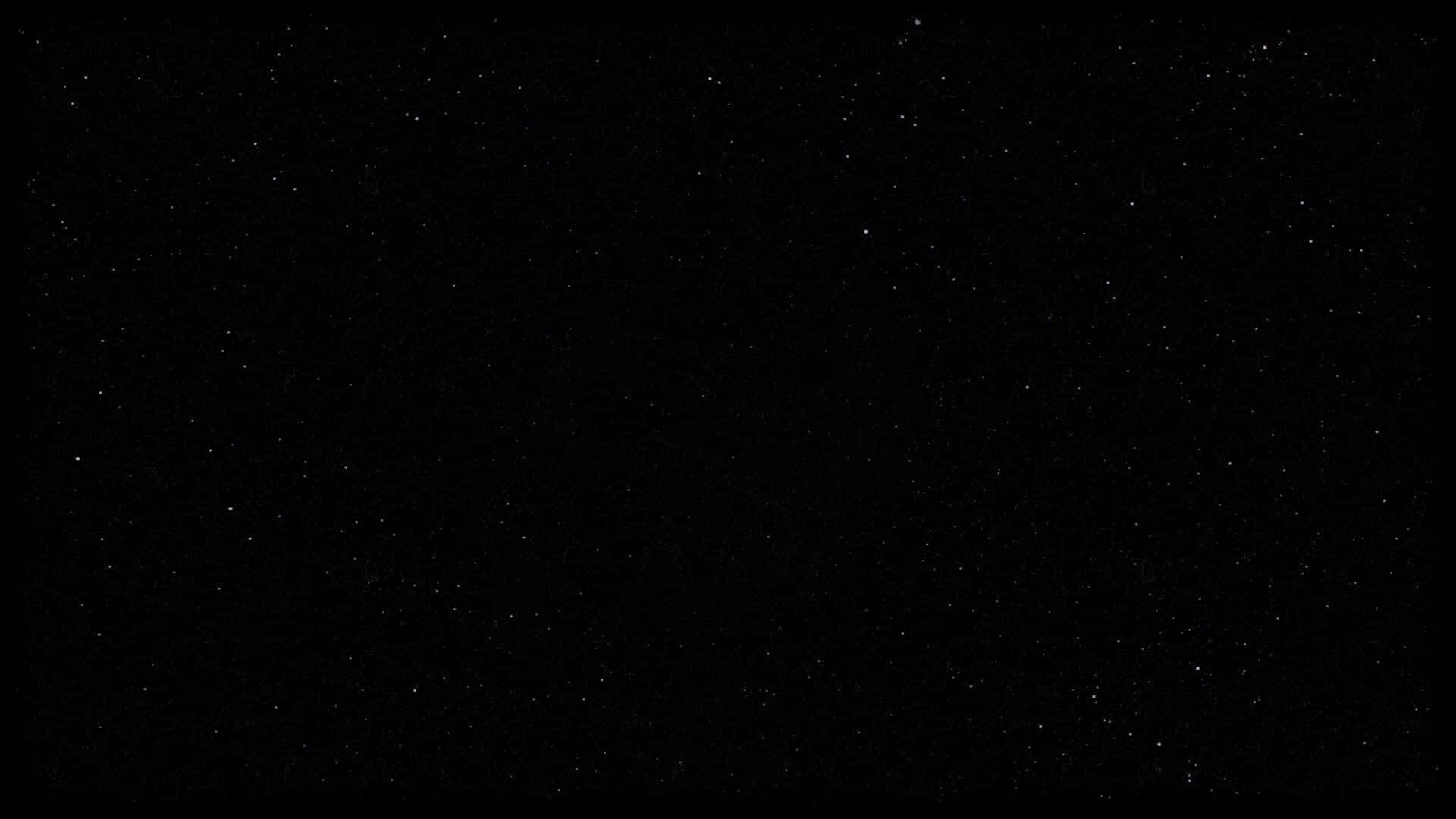 美學筆電 桌布 壁紙 — 廣闊的黑色天空中佈滿了無數閃爍的星星，營造出寧靜的宇宙場景。