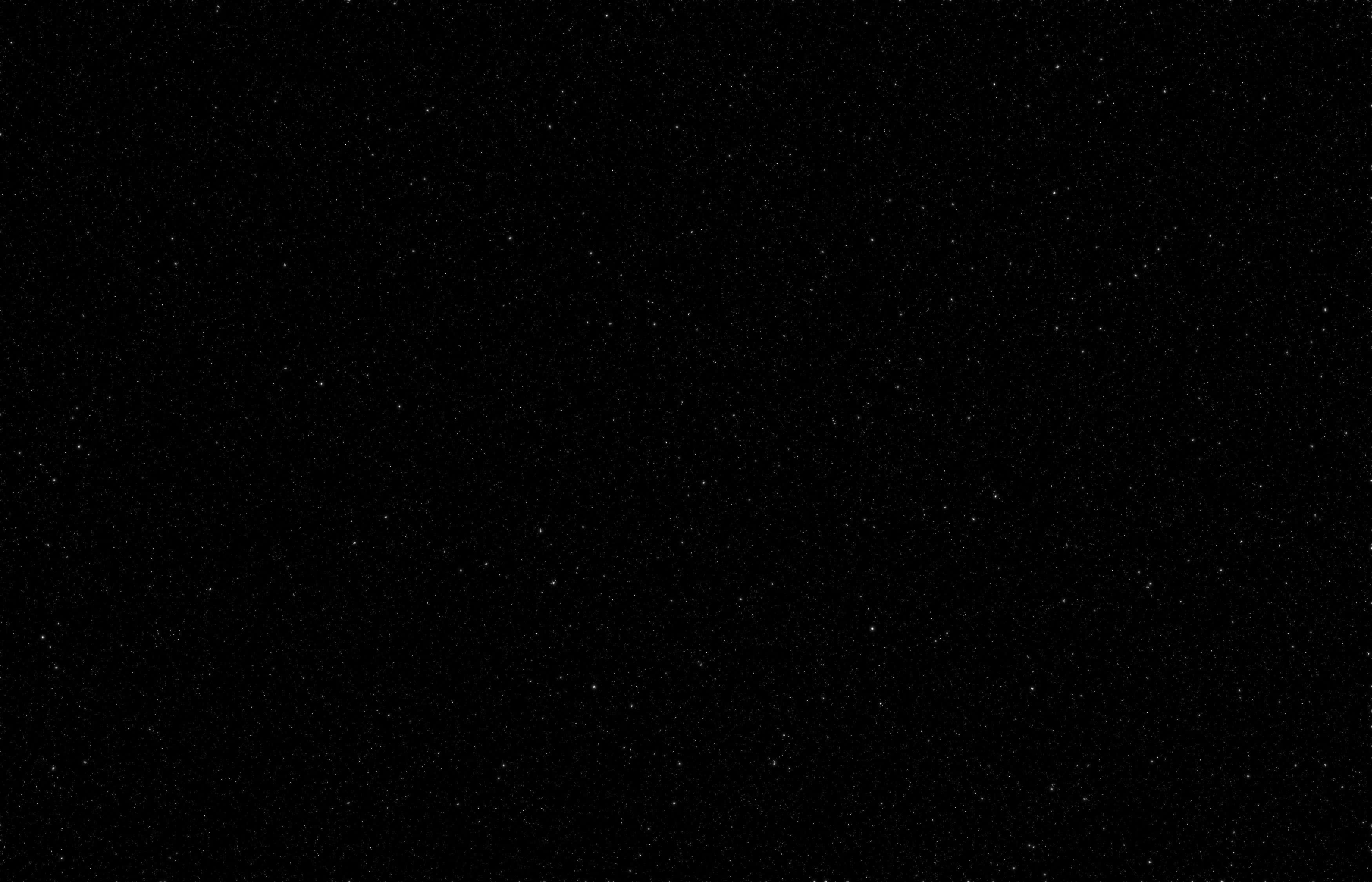 Stars 桌布 壁紙 — 廣闊的黑色天空中點綴著無數細小的白色星星，營造出寧靜的宇宙空間。