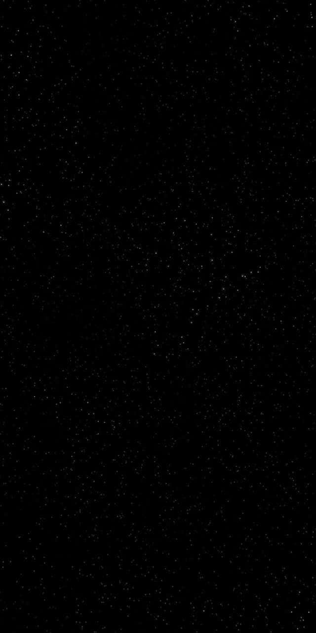 Stars 桌布 壁紙 — 廣闊的黑色畫布上點綴著無數細小的白色星星，營造出寧靜的宇宙夜空。