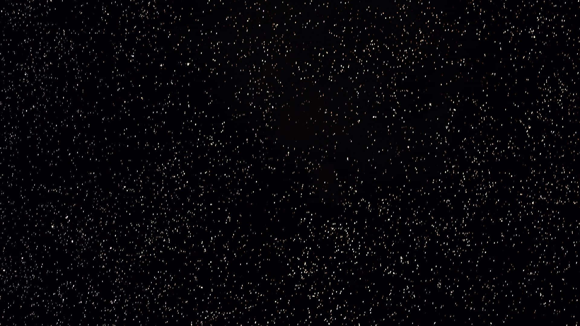 Starry Sky 桌布 壁紙 — 廣闊黑暗的宇宙，充滿無數閃爍的星星，中心有微弱發光的星雲。
