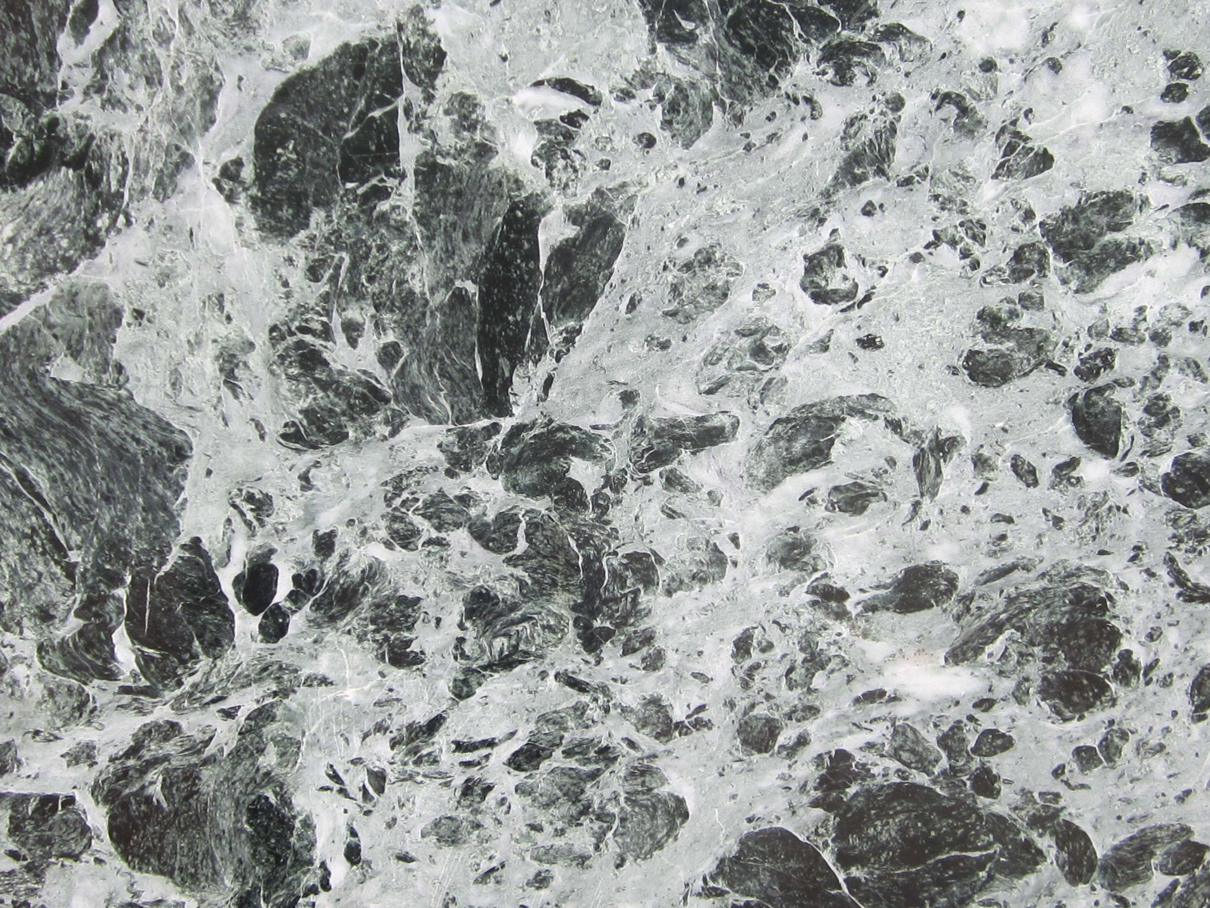 Granite 桌布 壁紙 — 引人注目的黑白大理石表面特寫，帶有漩渦狀紋理和質感圖案。
