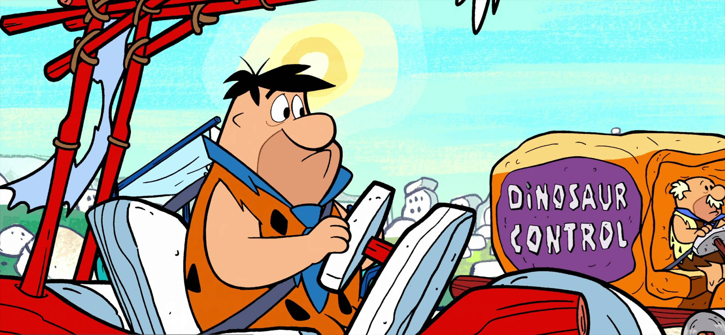 Flintstone 桌布 壁紙 — 弗雷德·弗林斯通駕駛一輛標有恐龍控制的石器時代汽車，在明亮的陽光下露出驚訝的表情。