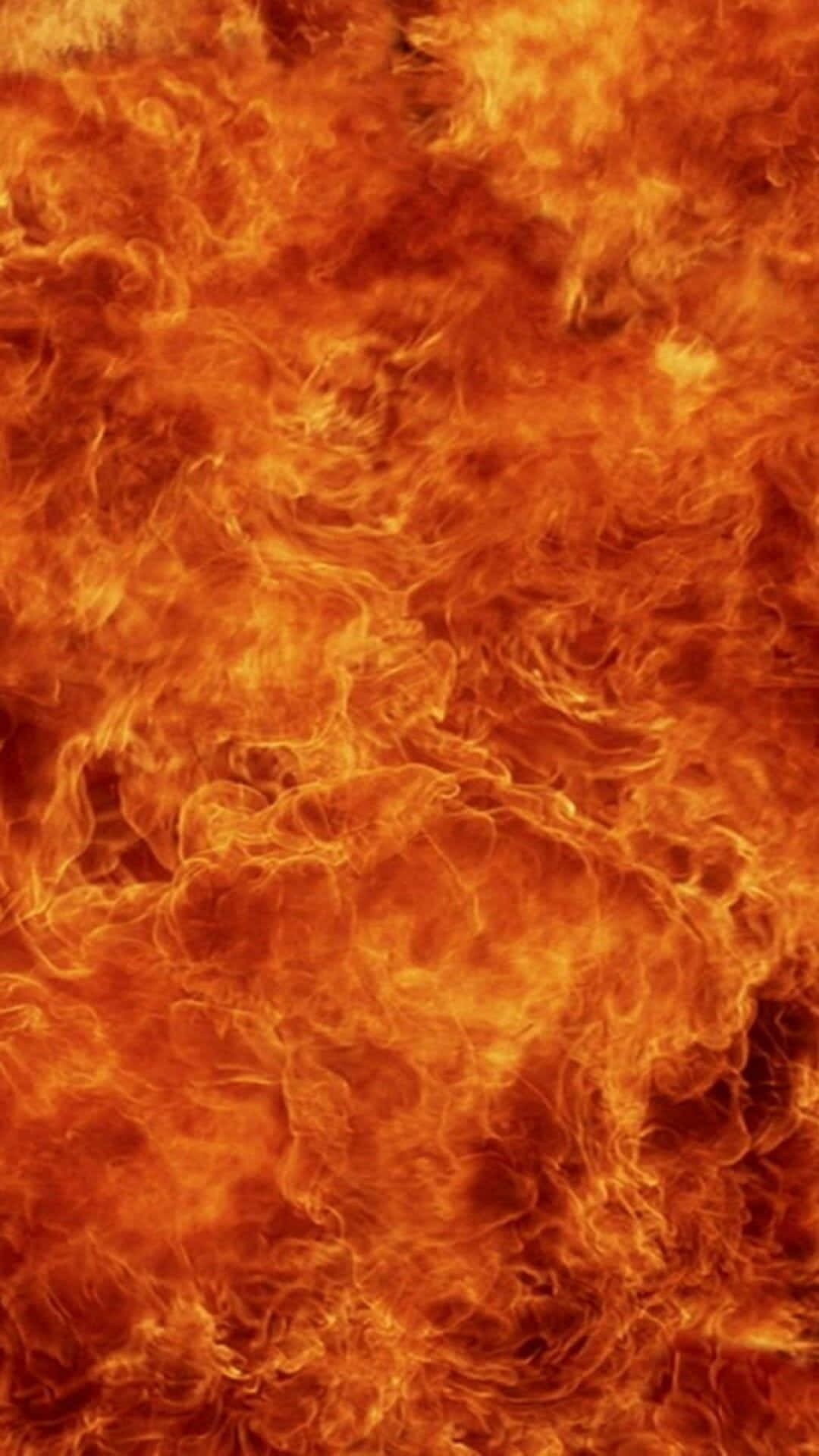 Android Fire 桌布 壁紙 — 強烈旋轉的火焰以鮮豔的橙色和黃色色調充滿畫面，呈現動態運動。