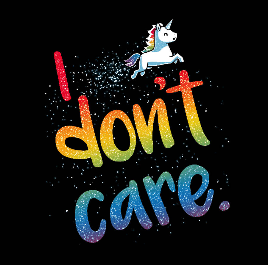 I Dont Care 桌布 壁紙 — 彩虹閃粉文字寫著「I don't care」，配上一隻飛翔的獨角獸，背景是星空黑色。
