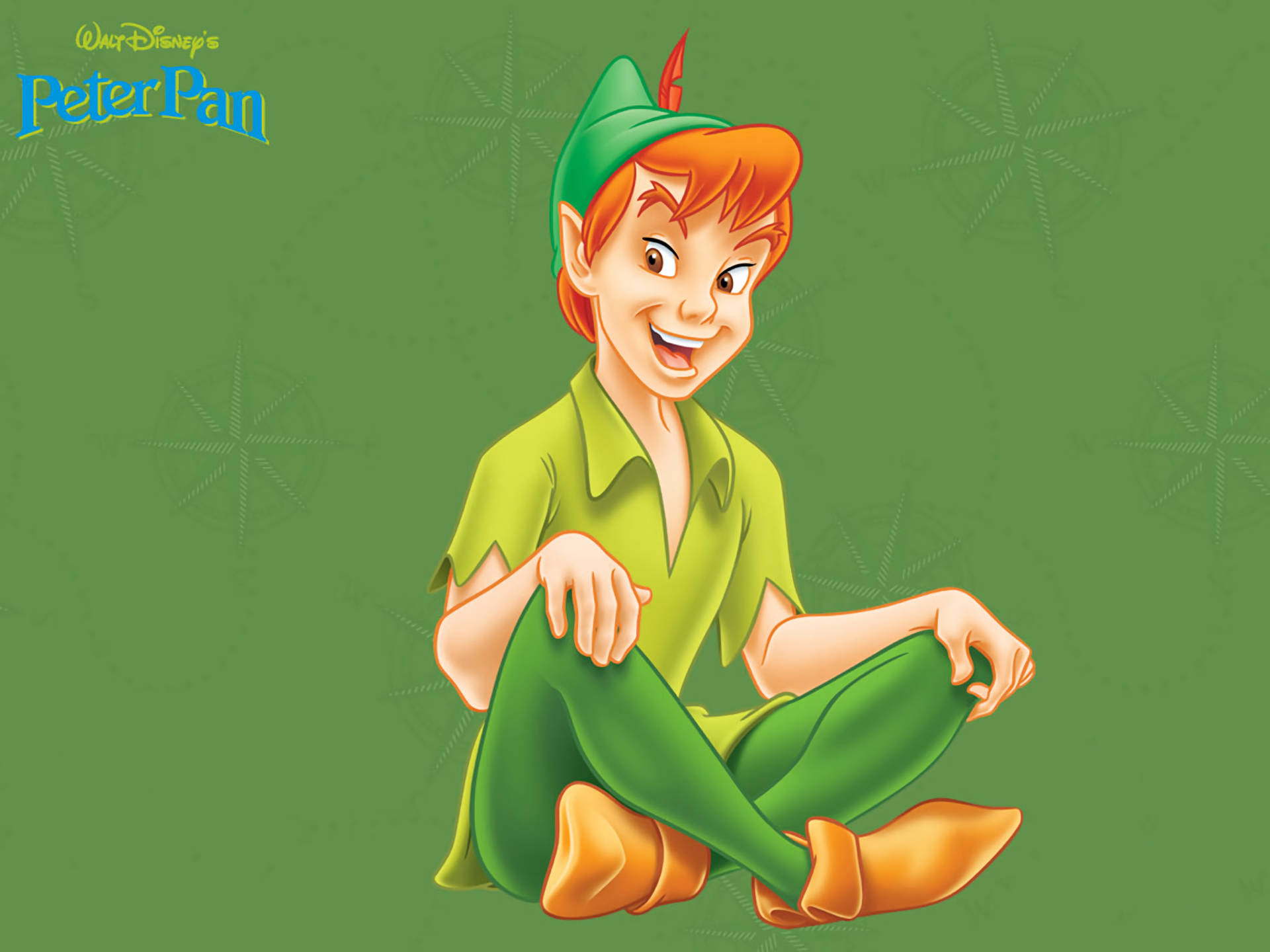 Peter Pan 桌布 壁紙 — 彼得潘以他標誌性的綠色服裝盤腿坐在星形圖案的綠色背景前。