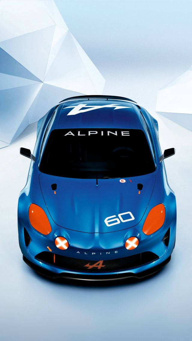 手機 桌布 壁紙 — 從上方俯瞰，一輛時尚的藍色Alpine A60跑車帶有橙色點綴，背景為幾何白色。