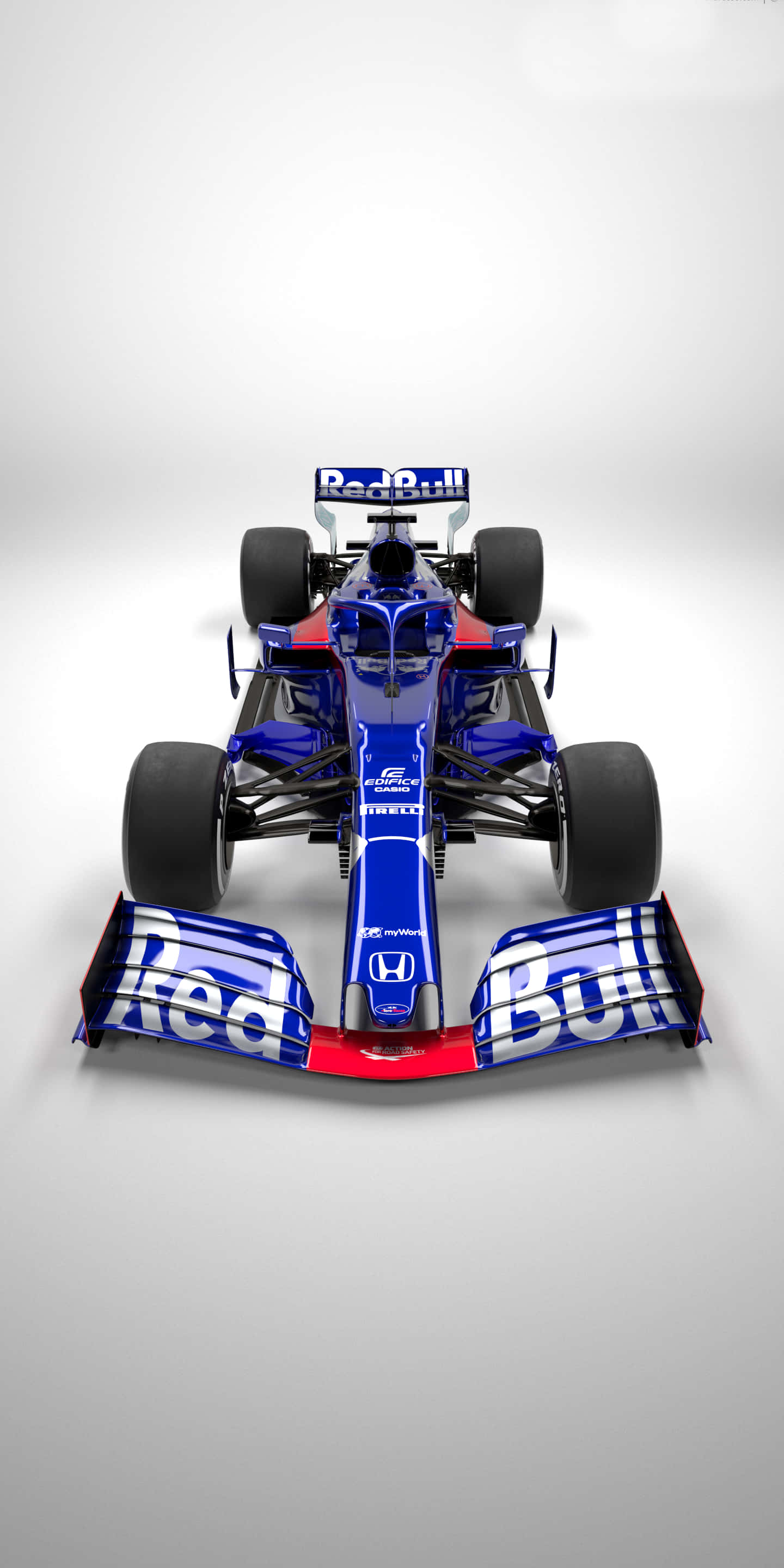 F1 2016 桌布 壁紙 — 從上方俯瞰，在純白工作室背景前，一輛時尚的藍紅配色Red Bull一級方程式賽車。