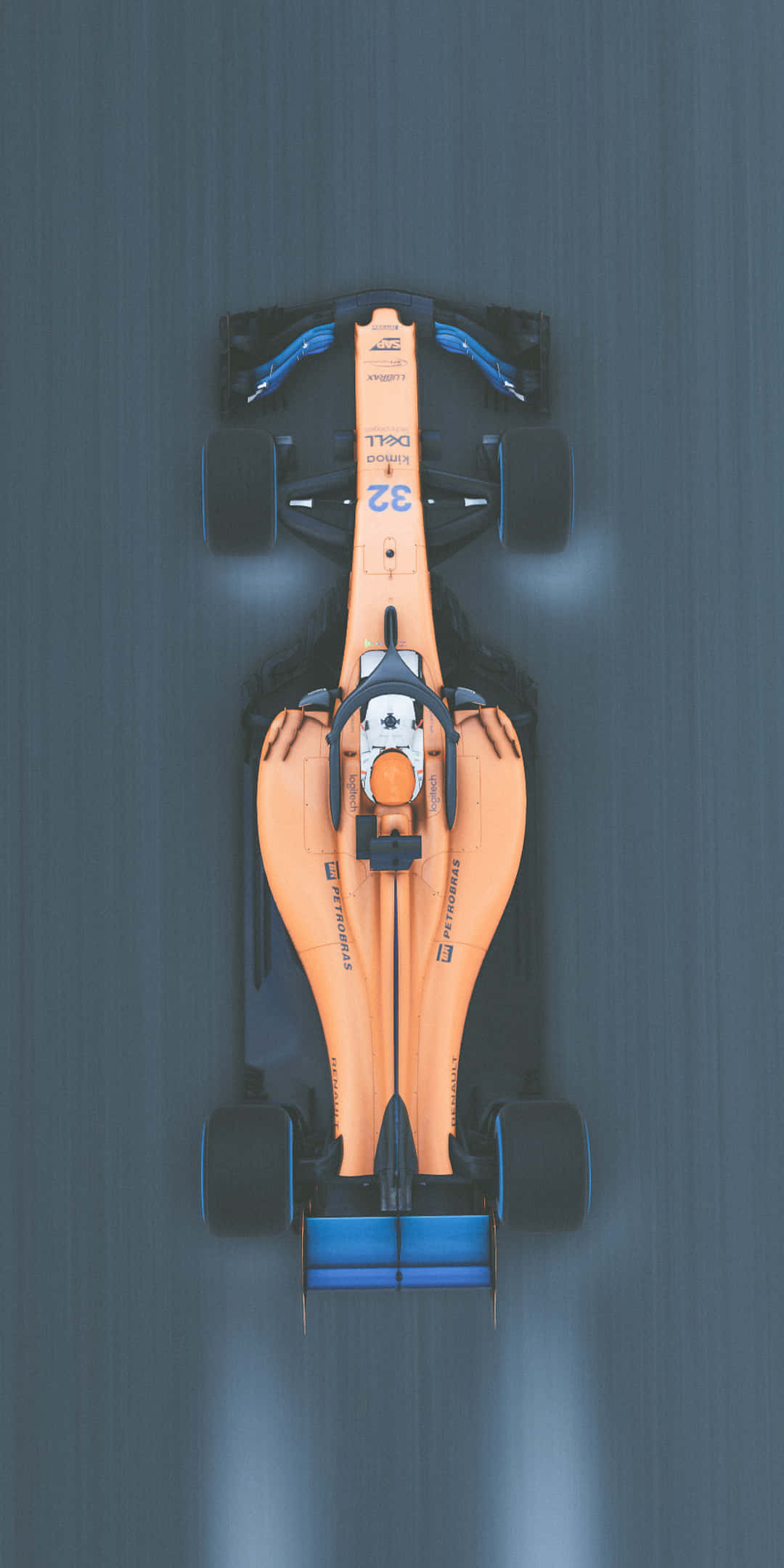 F1 桌布 壁紙 — 從上方俯瞰一輛橙色和藍色的一級方程式賽車在灰色賽道上疾馳，帶有動態模糊效果。