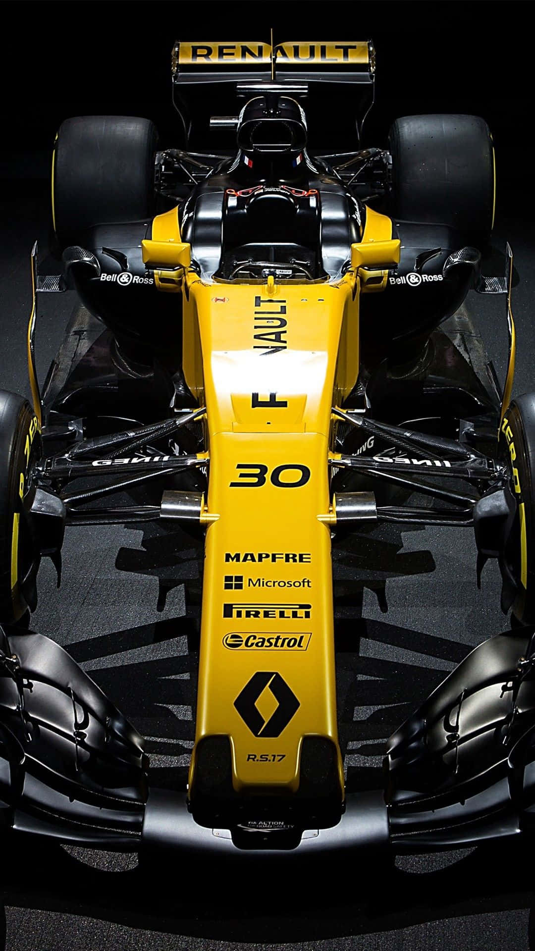 F1 2016 桌布 壁紙 — 從上方俯瞰一輛黃黑相間的雷諾一級方程式賽車，車號30，停放在深色攝影棚地板上。