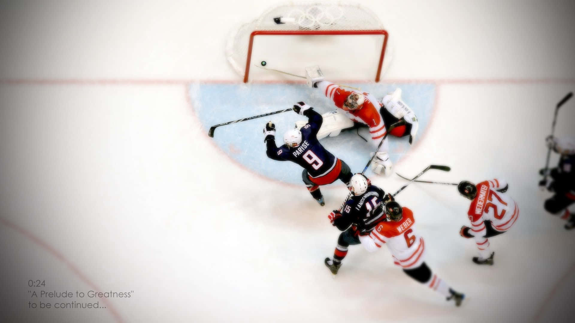 hockey 桌布 壁紙 — 從上方俯瞰冰球運動員在球門附近激烈專注且動態移動的畫面。