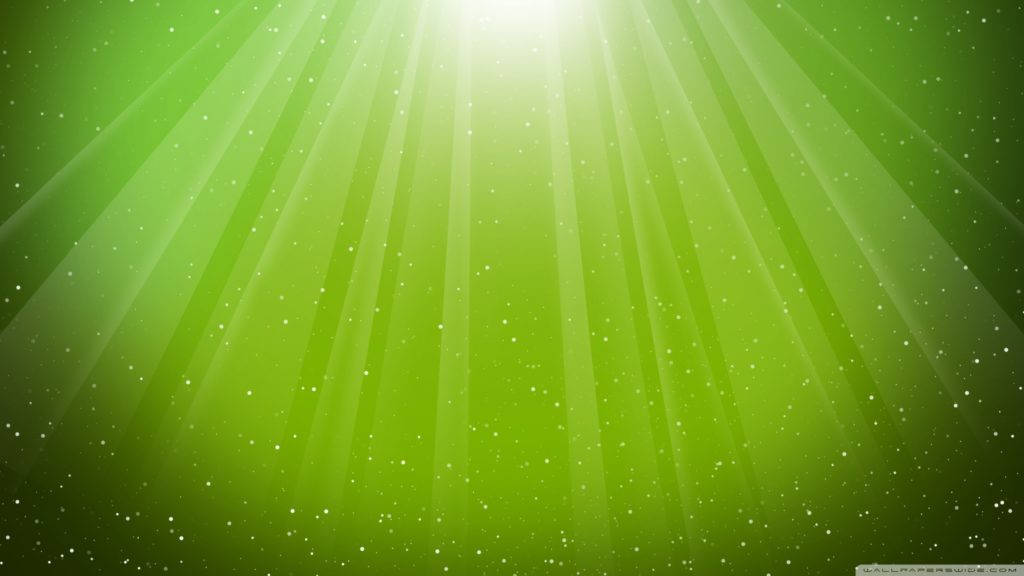 微軟桌面 桌布 壁紙 — 從上方迸發出耀眼的綠色光束，照亮了閃爍粒子場，呈現出充滿活力的數位光芒。