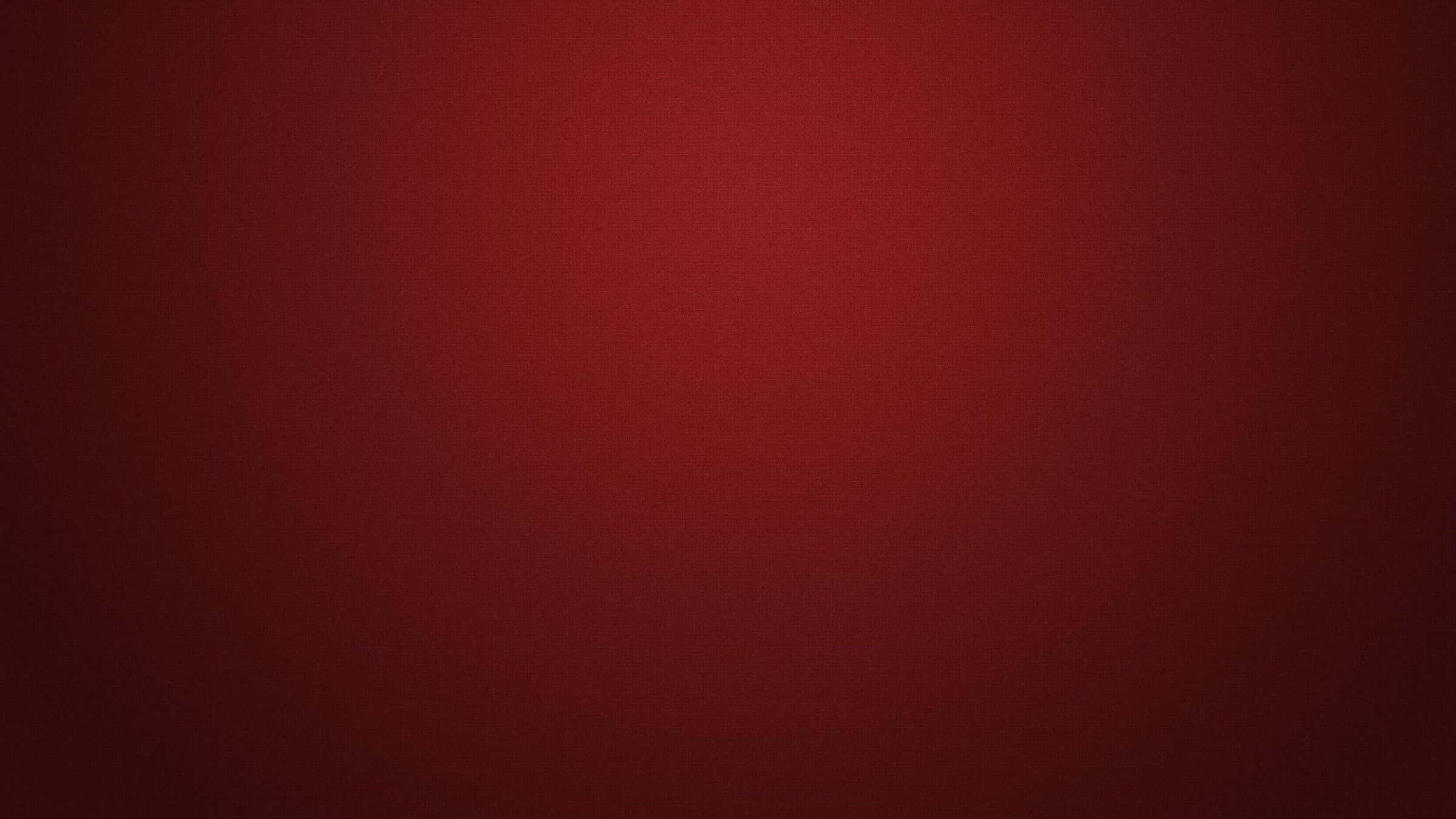 Dark Red Aesthetic 桌布 壁紙 — 從中心到邊緣逐漸淡出的深紅色平滑漸變，帶有細微紋理。