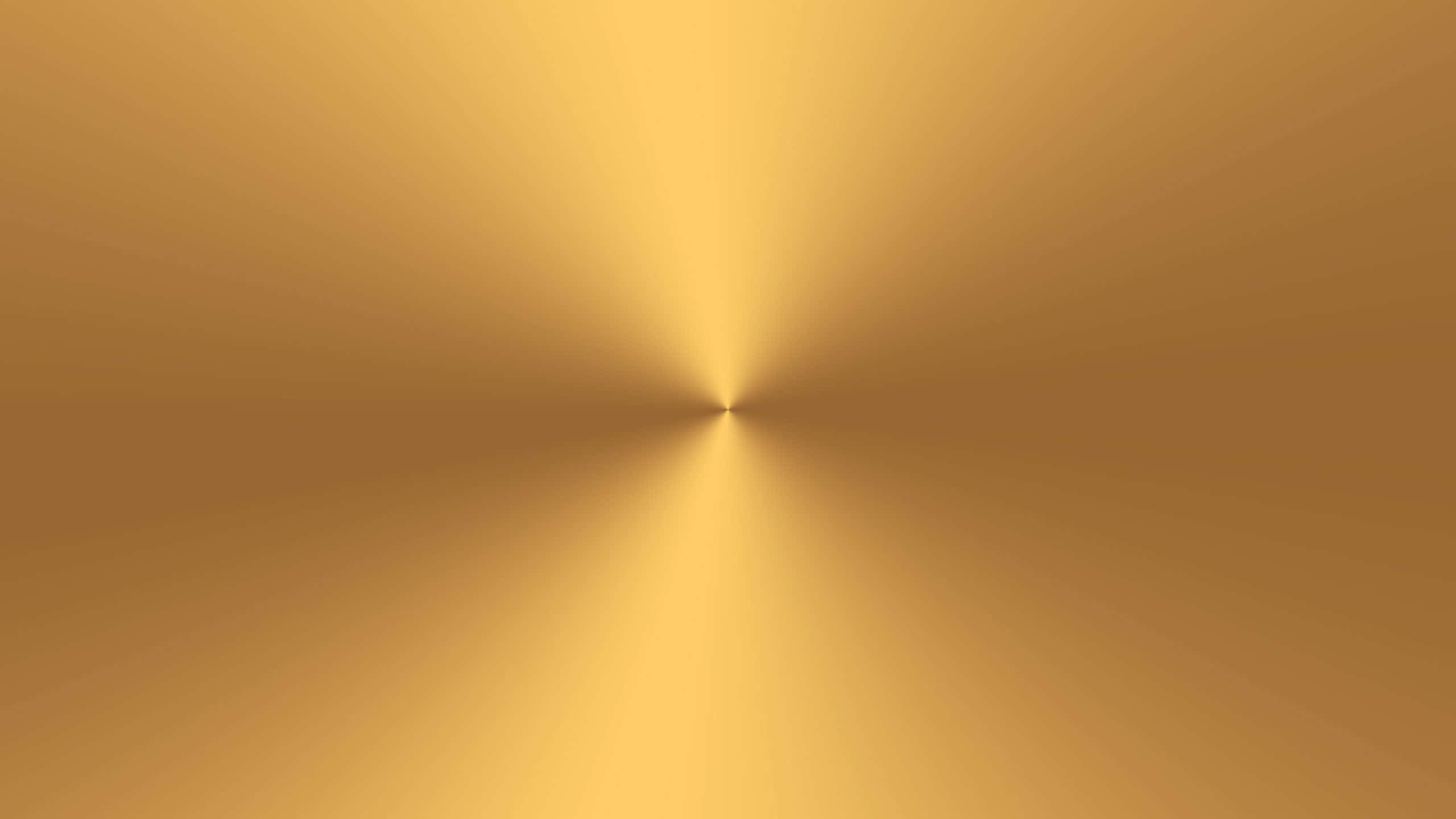 Gold Texture 桌布 壁紙 — 從中心點向外輻射的閃耀金色漸層，營造出溫暖的抽象背景。