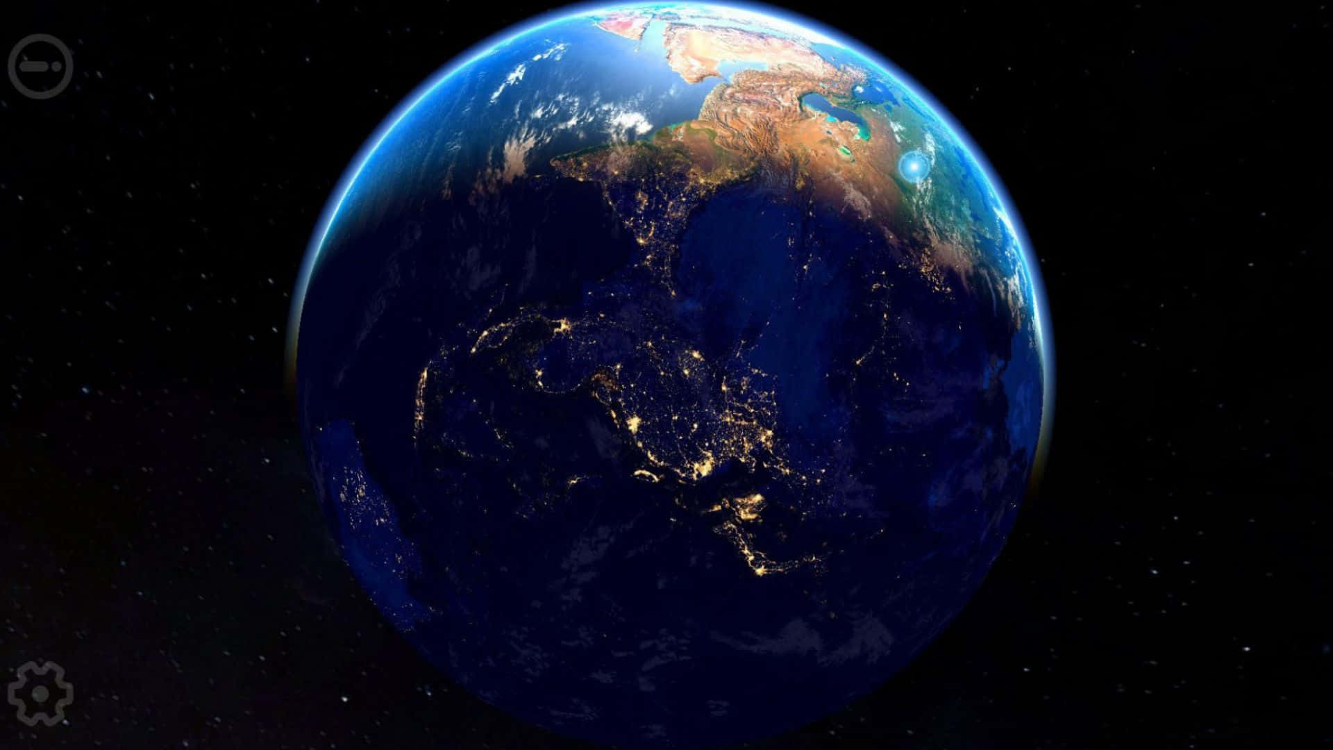 3d Earth 桌布 壁紙 — 從太空俯瞰地球的壯麗夜景，城市燈光閃爍，照亮了深藍色海洋和繁星點點的黑夜中的各大洲。