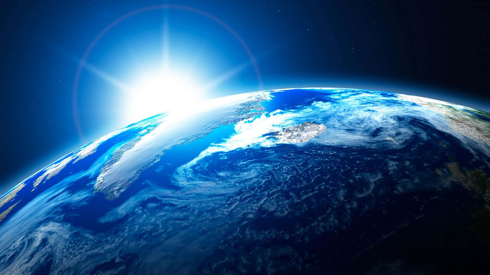 World 桌布 壁紙 — 從太空俯瞰地球的壯麗景色，太陽在藍色海洋和漩渦狀雲層上方升起。