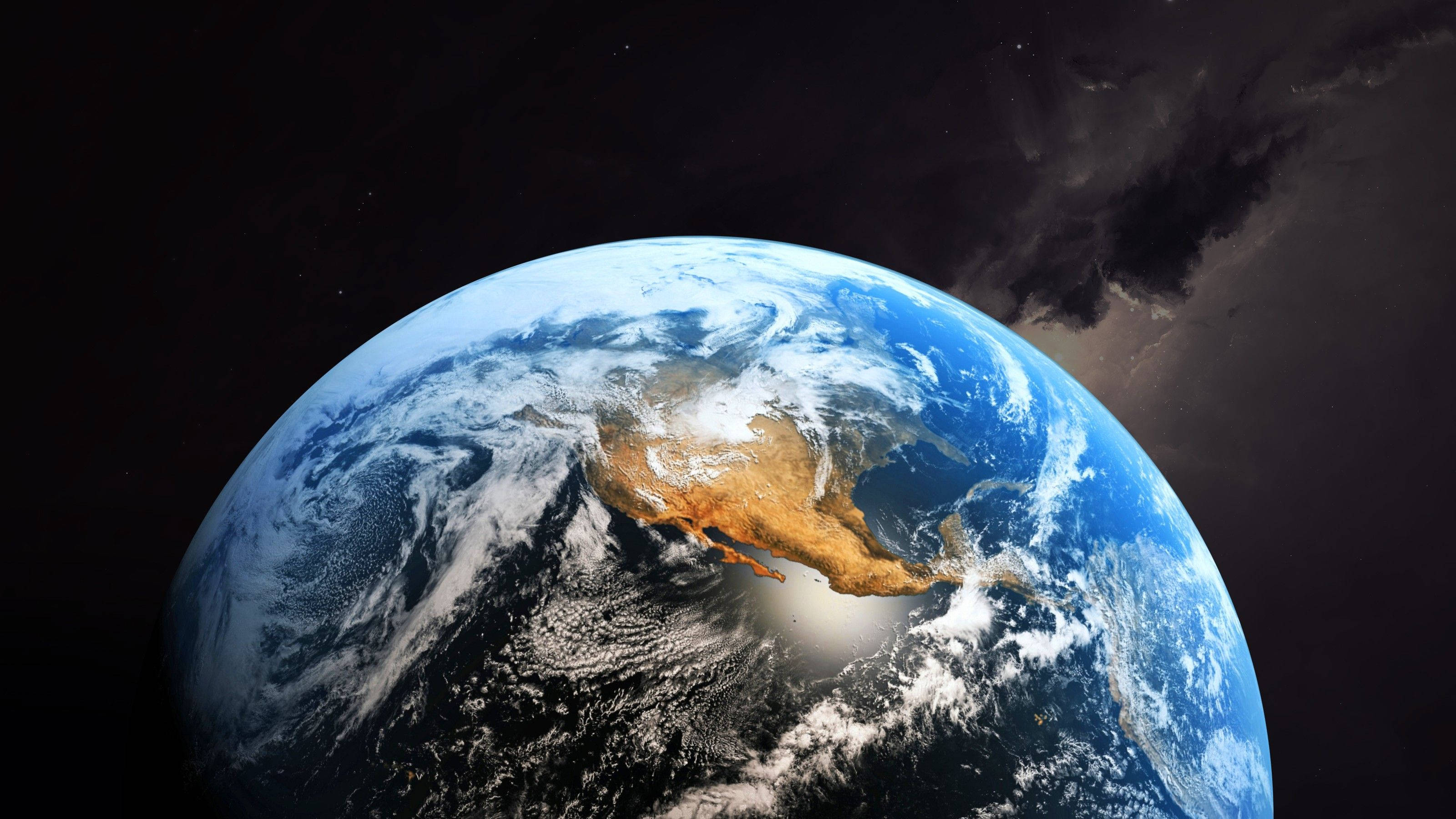 World Globe 桌布 壁紙 — 從太空俯瞰地球的壯麗景色，展示北美洲被旋轉的雲層和深藍色海洋環繞，背景是太空的黑色虛空。