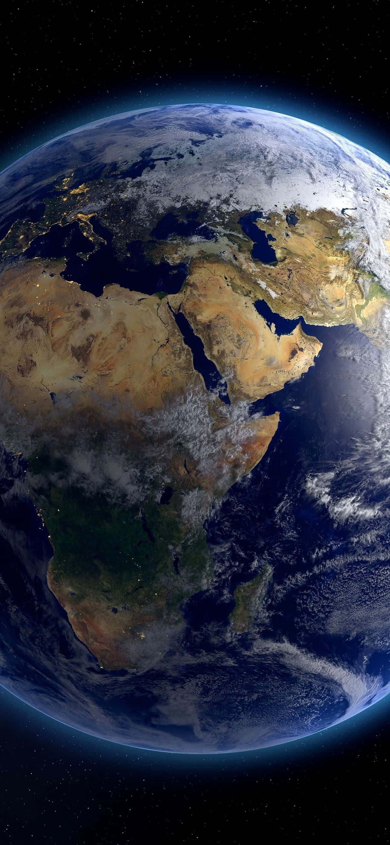 planet earth 桌布 壁紙 — 從太空俯瞰地球的壯麗景色，展示非洲和中東，漩渦狀的雲層和閃爍的城市燈光映襯著太空的黑色虛空。