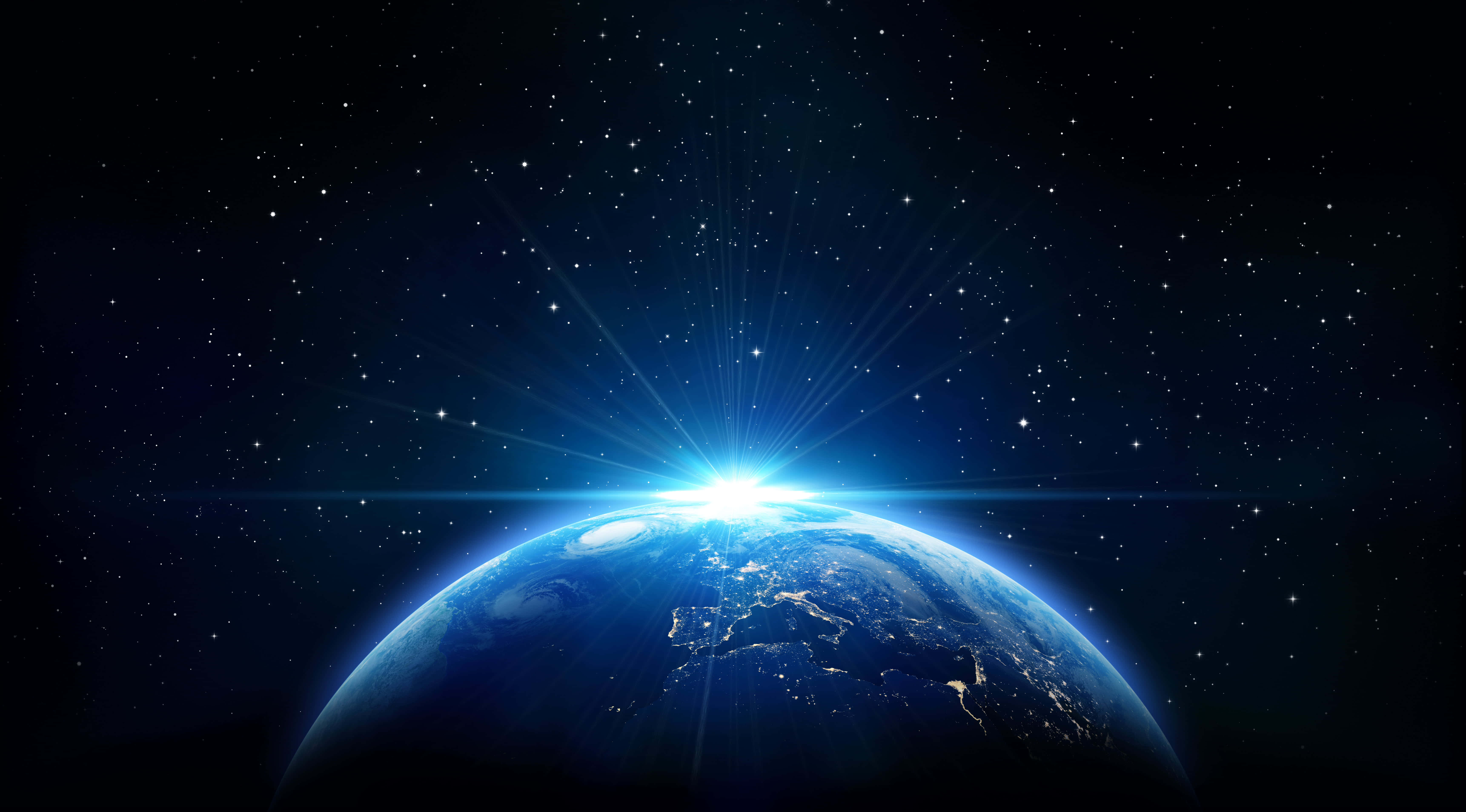 Starry 桌布 壁紙 — 從太空俯瞰地球的壯麗景色，燦爛的日出在彎曲的地平線上綻放，背景是繁星點點。