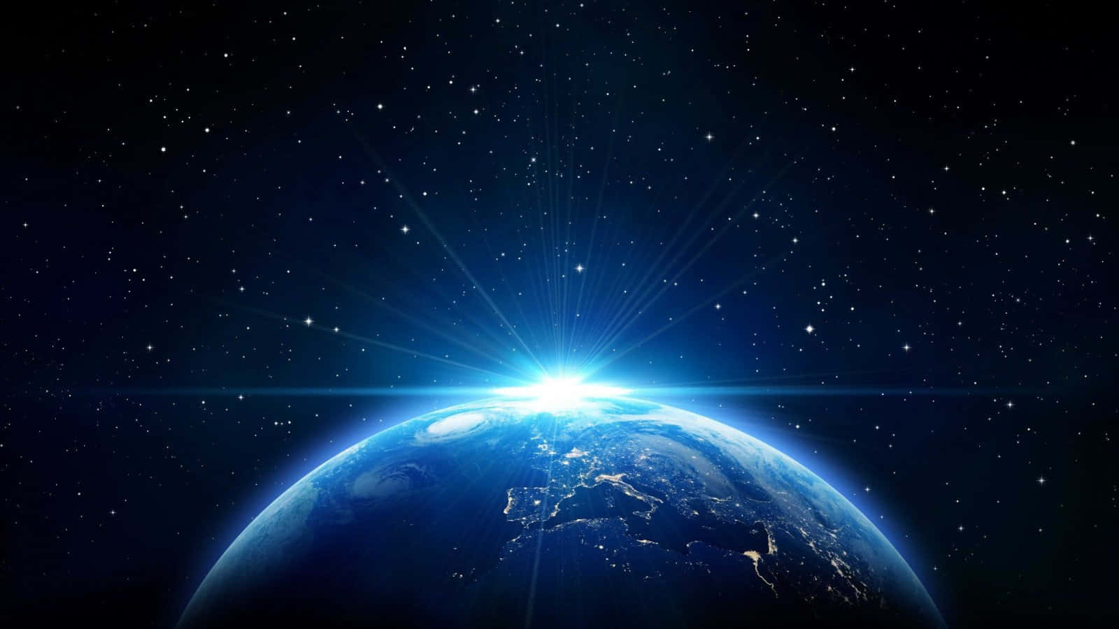 宇宙 桌布 壁紙 — 從太空俯瞰地球的壯麗景色，燦爛的日出照亮了行星彎曲的地平線，背景是繁星點點的宇宙。