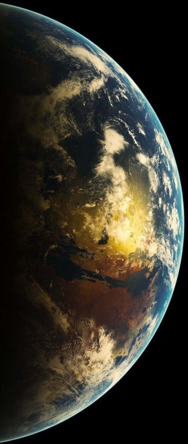 iPhone Earth 桌布 壁紙 — 從太空俯瞰地球的壯麗景色，燦爛的日出照亮雲層和海洋，映襯著漆黑的虛空。