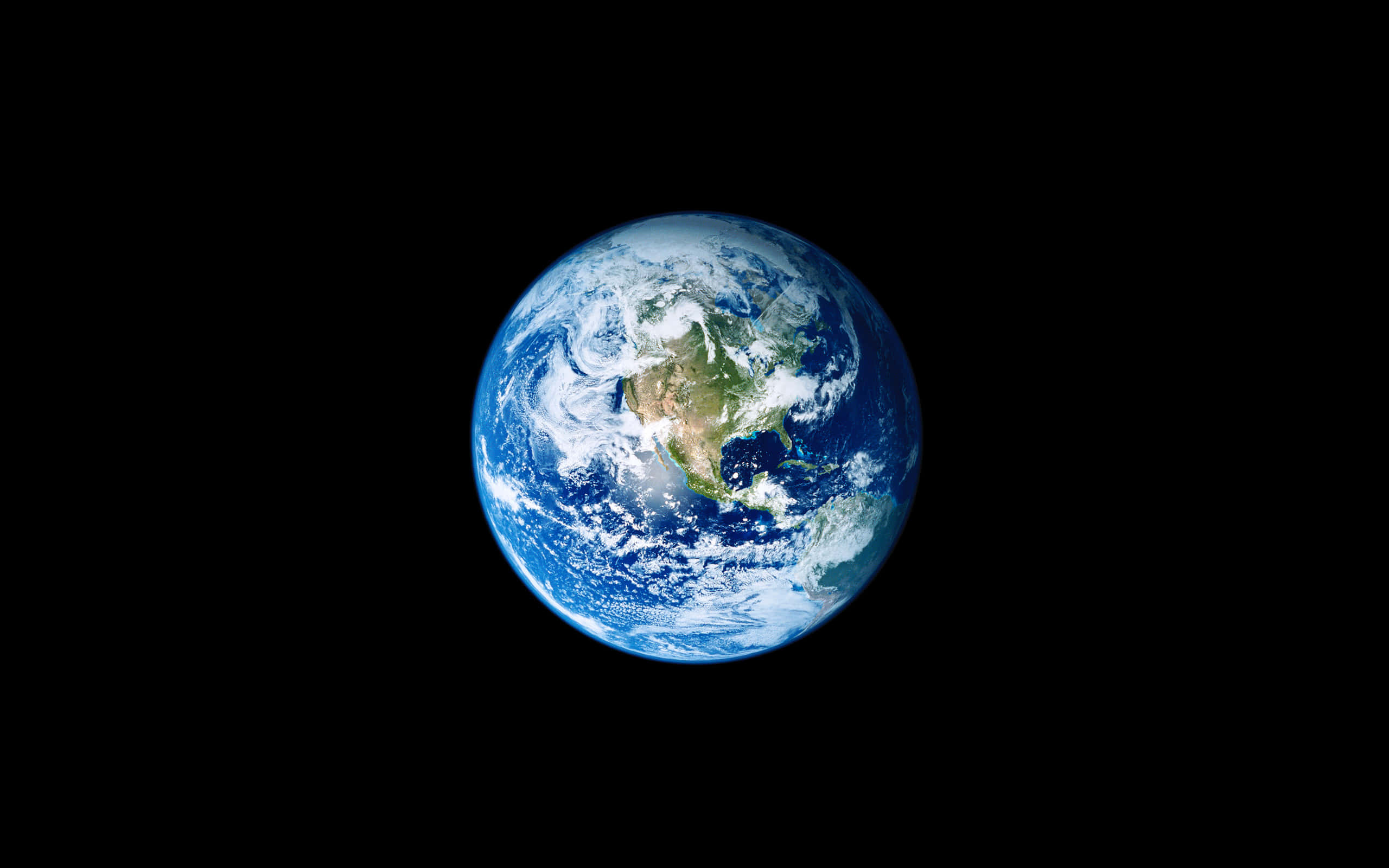 地球 桌布 壁紙 — 從太空俯瞰地球的壯麗景色，顯示北美洲上空旋轉的雲層，背景是深邃的黑色虛空。