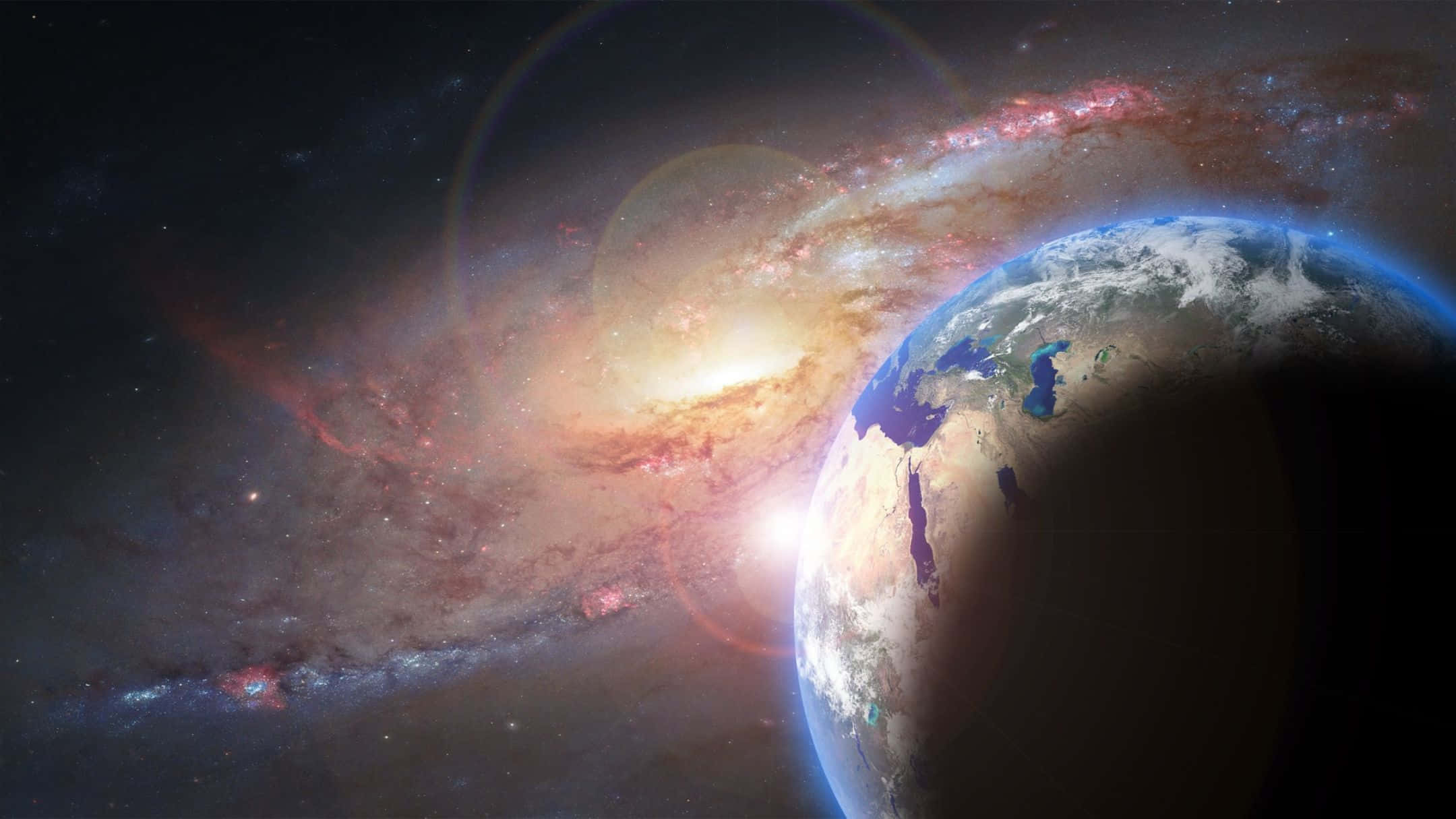 2160x1215 桌布 壁紙 — 從太空俯瞰地球的壯麗景象，一個充滿活力的螺旋星系在深邃的宇宙黑暗中於其後閃耀。