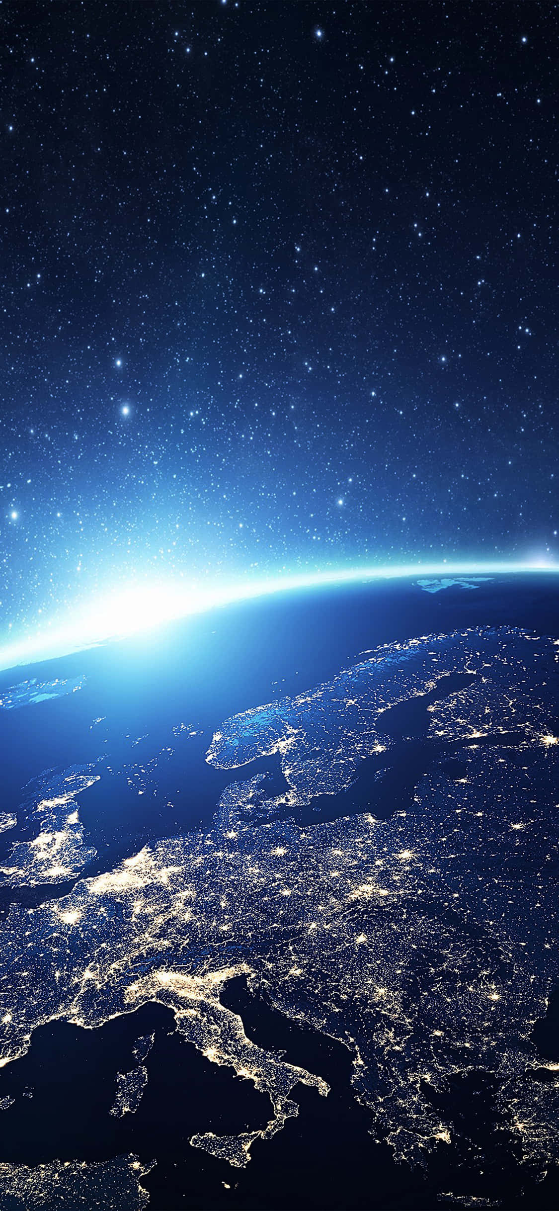 桌布 壁紙 — 從太空夜間俯瞰地球的壯麗景色，城市燈光閃爍，星空璀璨。