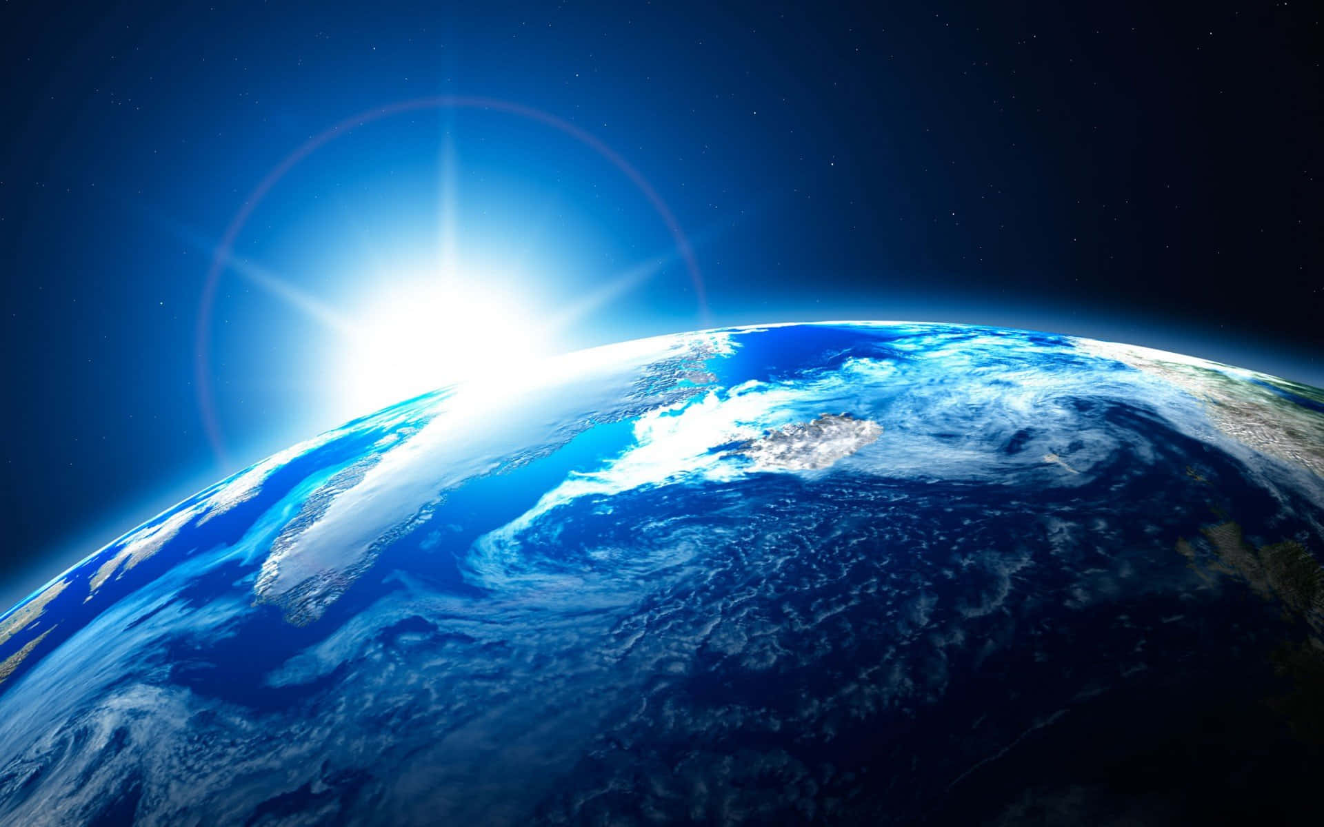 地球 桌布 壁紙 — 從太空看到地球的壯麗景色，太陽在藍色海洋和旋轉的白雲上空升起。