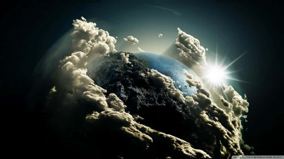 桌布 壁紙 — 從太空看到地球的戲劇性景象，有旋轉的雲層和明亮的太陽爆發照亮藍色的海洋和黑暗的陸地。