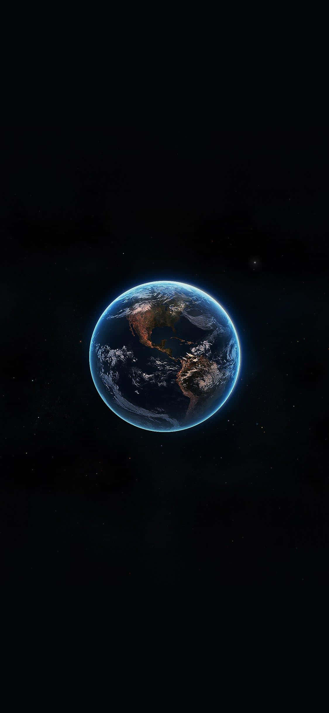 桌布 壁紙 — 從太空看到的地球壯麗景色，在繁星點點的黑色虛空中散發著藍色光環。