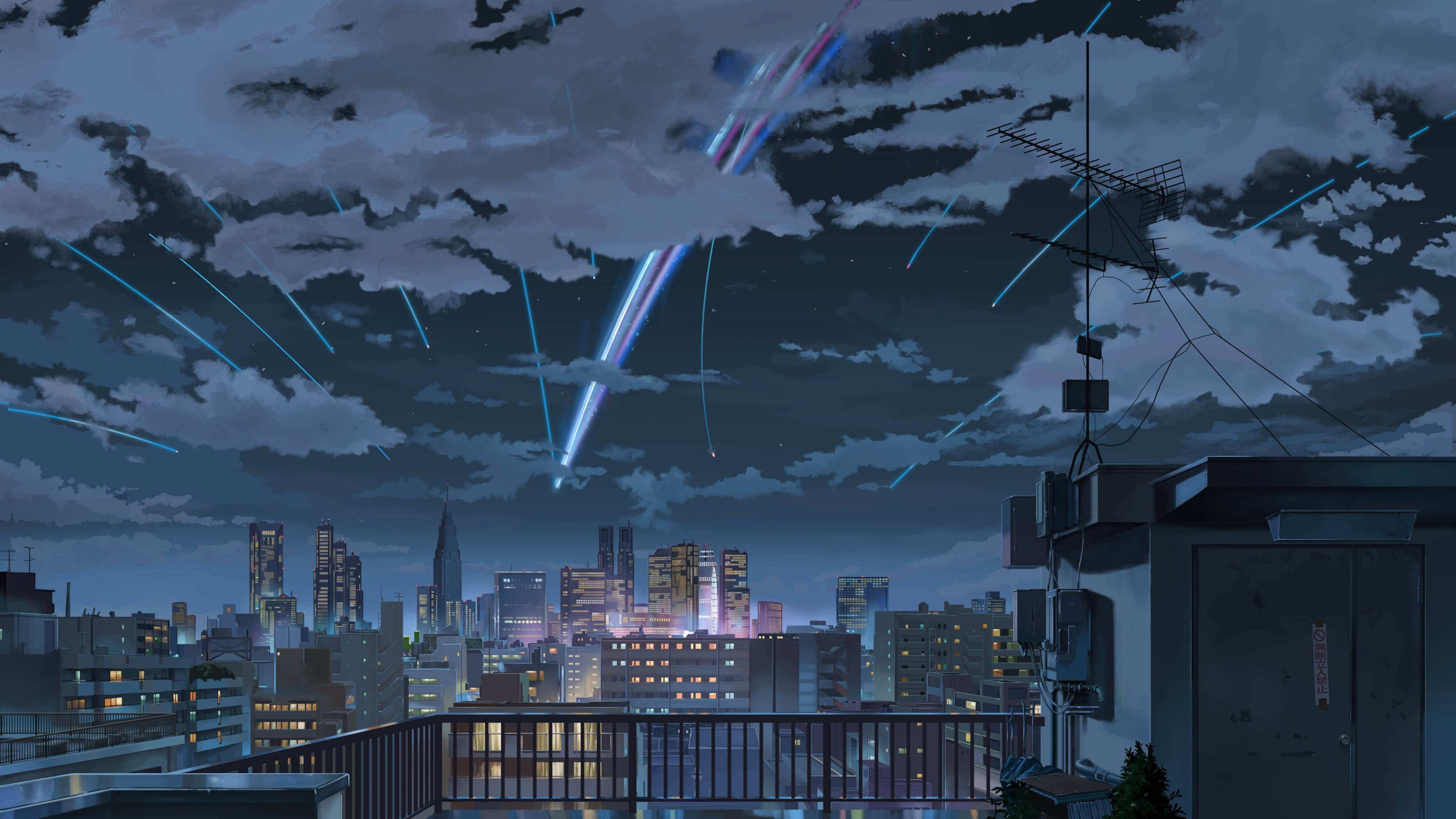 Makoto Shinkai 桌布 壁紙 — 從屋頂俯瞰霓虹燈照亮的夜晚城市，藍色光線劃過多雲的天空。