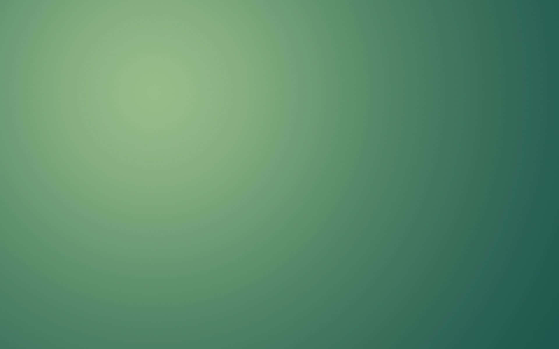 Green Gradient 桌布 壁紙 — 從明亮中心向較暗邊緣擴散的舒緩綠色漸變。