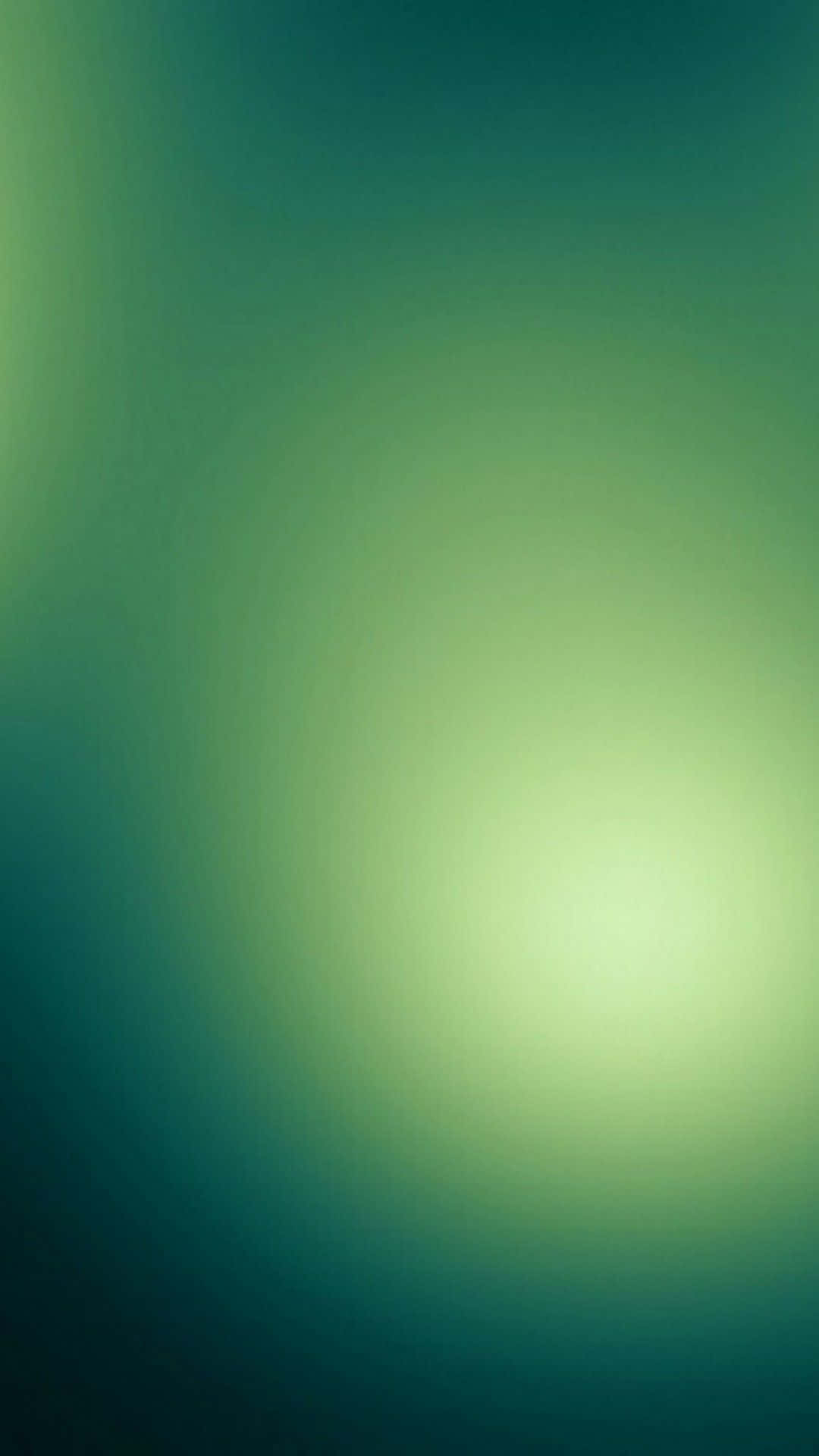 翡翠綠 桌布 壁紙 — 從明亮中心柔和散發的藍綠色和萊姆綠的寧靜漸變。