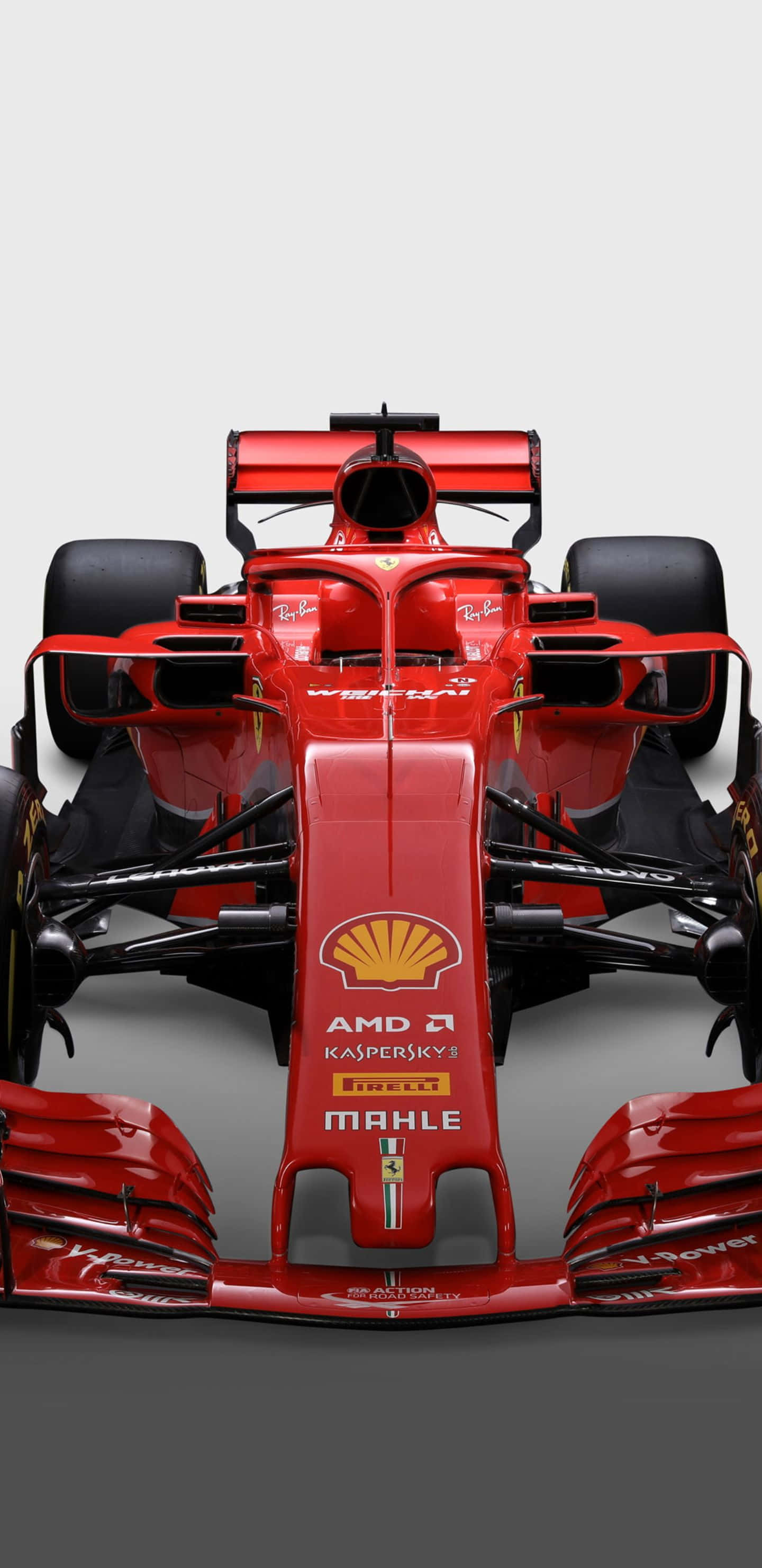 Formula 1 桌布 壁紙 — 從正面觀看，一輛時尚的紅色法拉利一級方程式賽車，背景為純灰色。