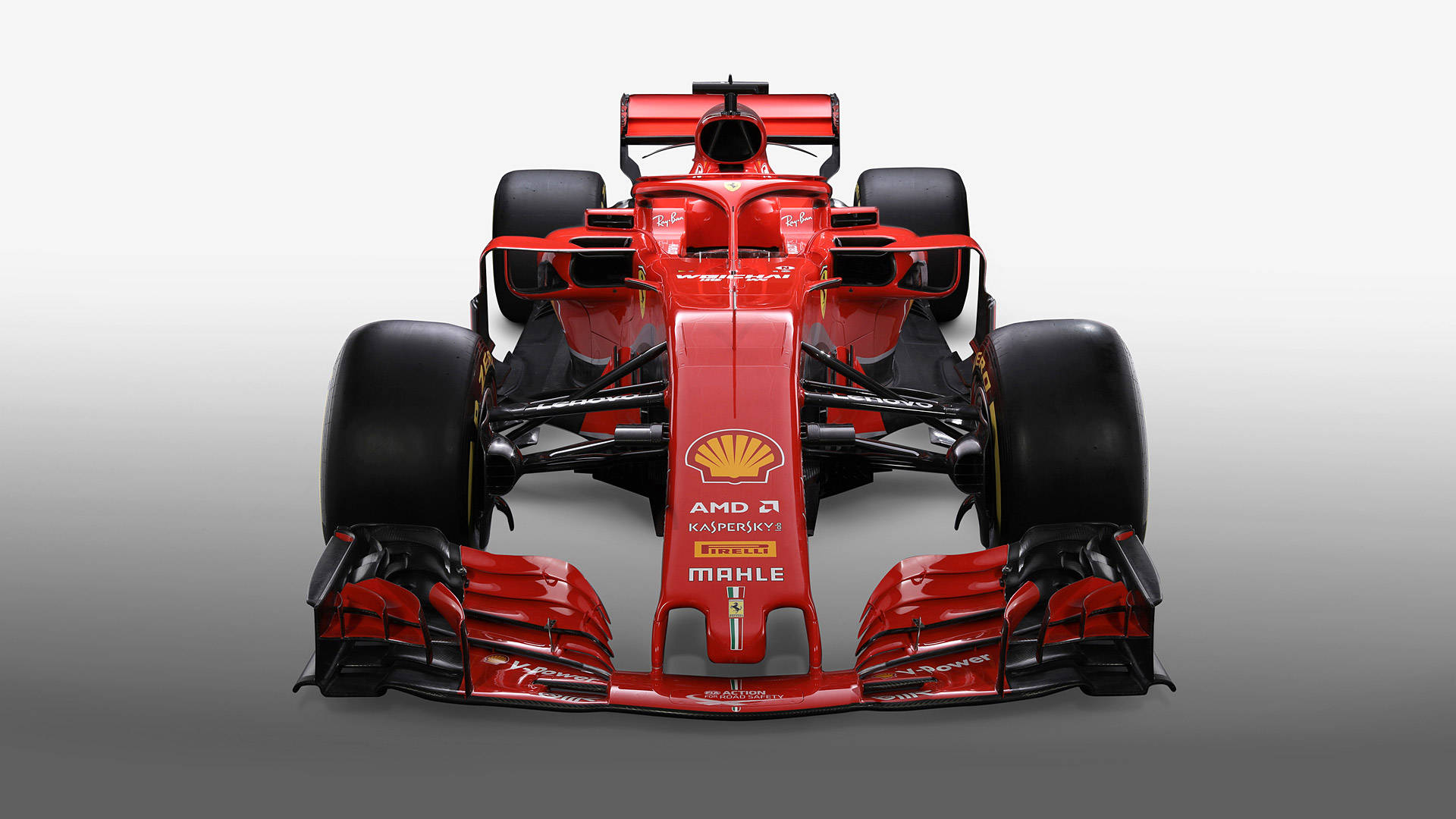 ferrari f1 2018 桌布 壁紙 — 從正面觀看，一輛時尚的紅色法拉利一級方程式賽車，背景為漸變灰色。