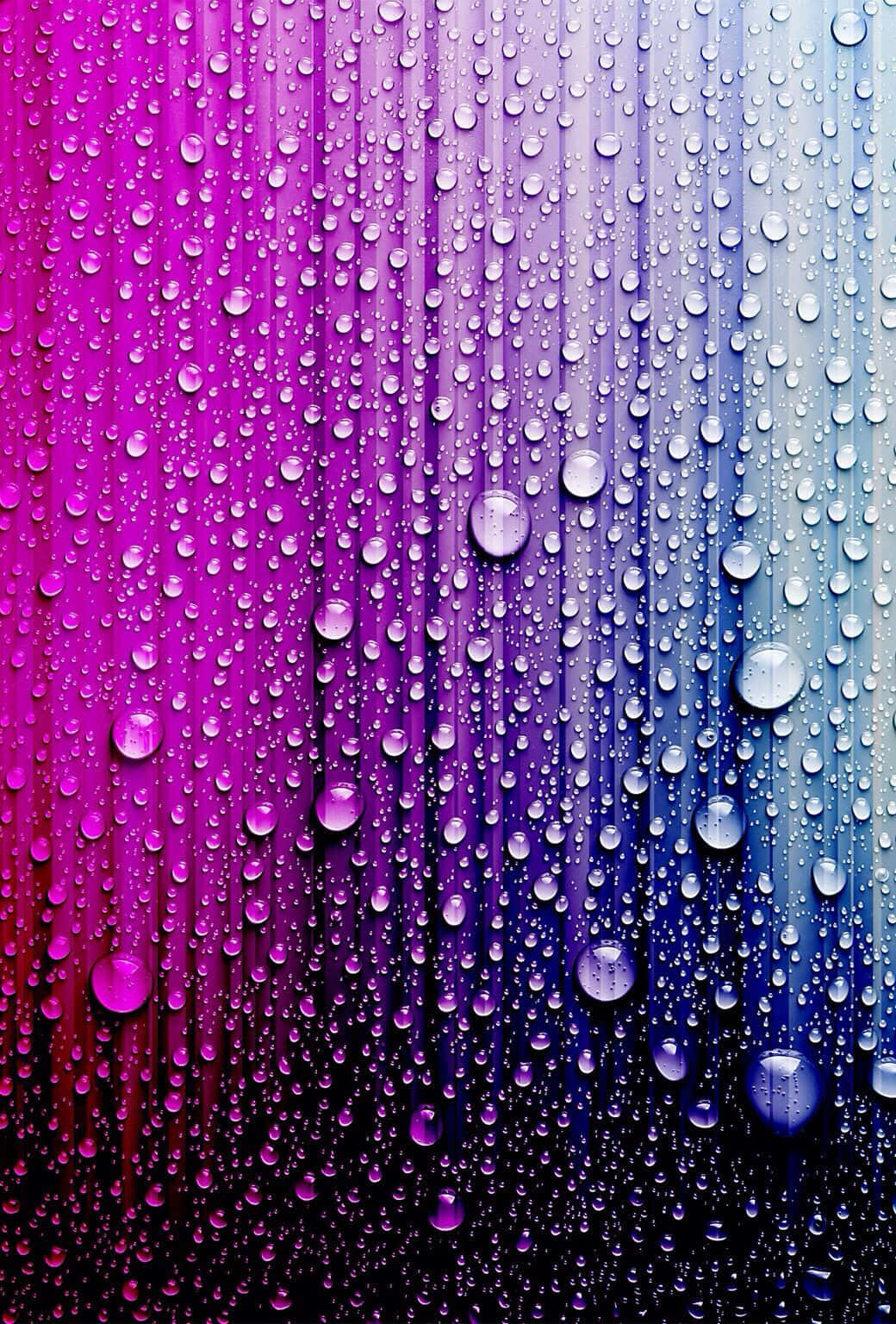 漂亮的動圖 桌布 壁紙 — 從洋紅色到青色的鮮豔漸變，雨滴沿玻璃表面流下。