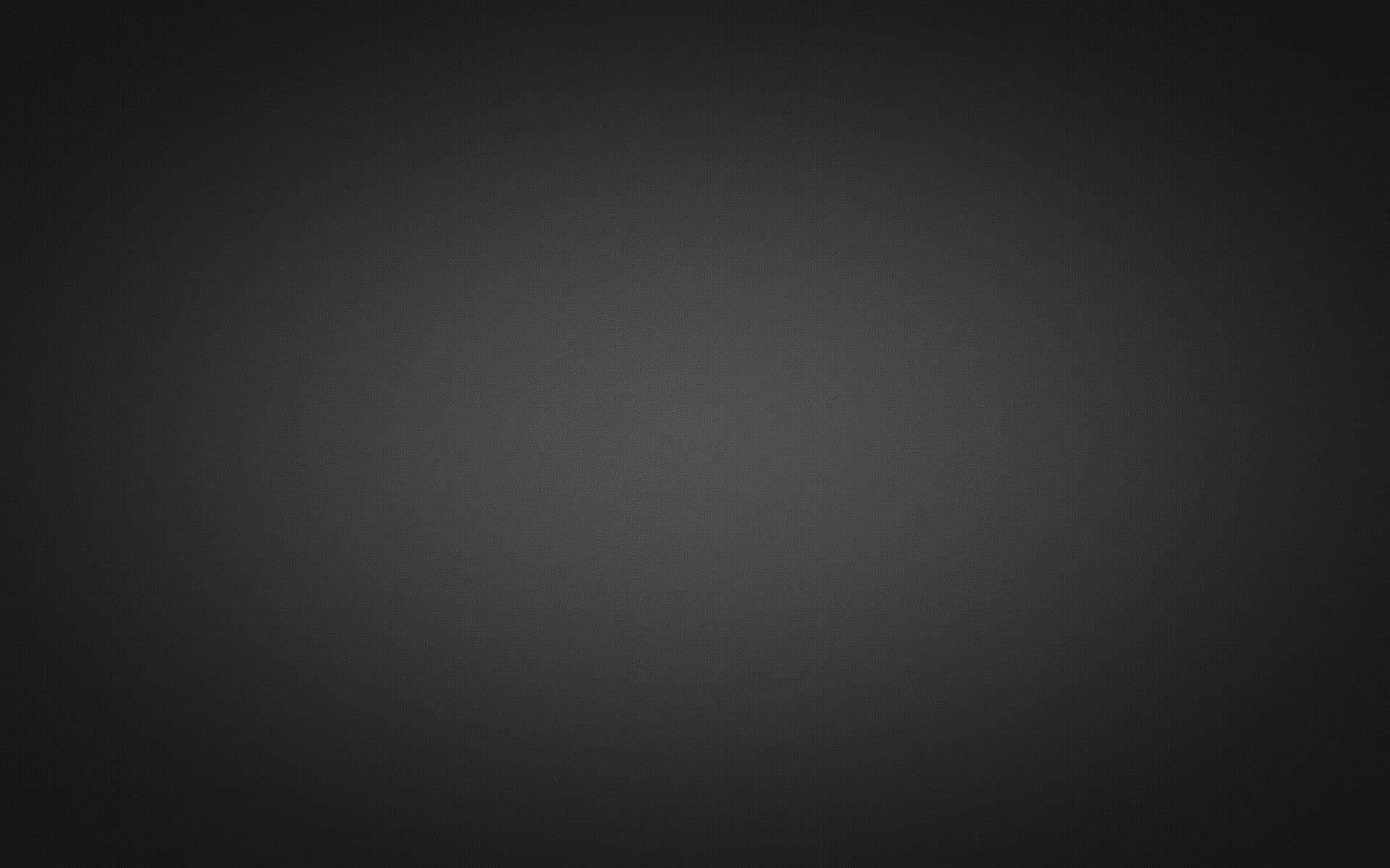 Gray Gradient 桌布 壁紙 — 從深灰色到邊緣漸變為黑色的平滑漸變，營造出極簡抽象背景。