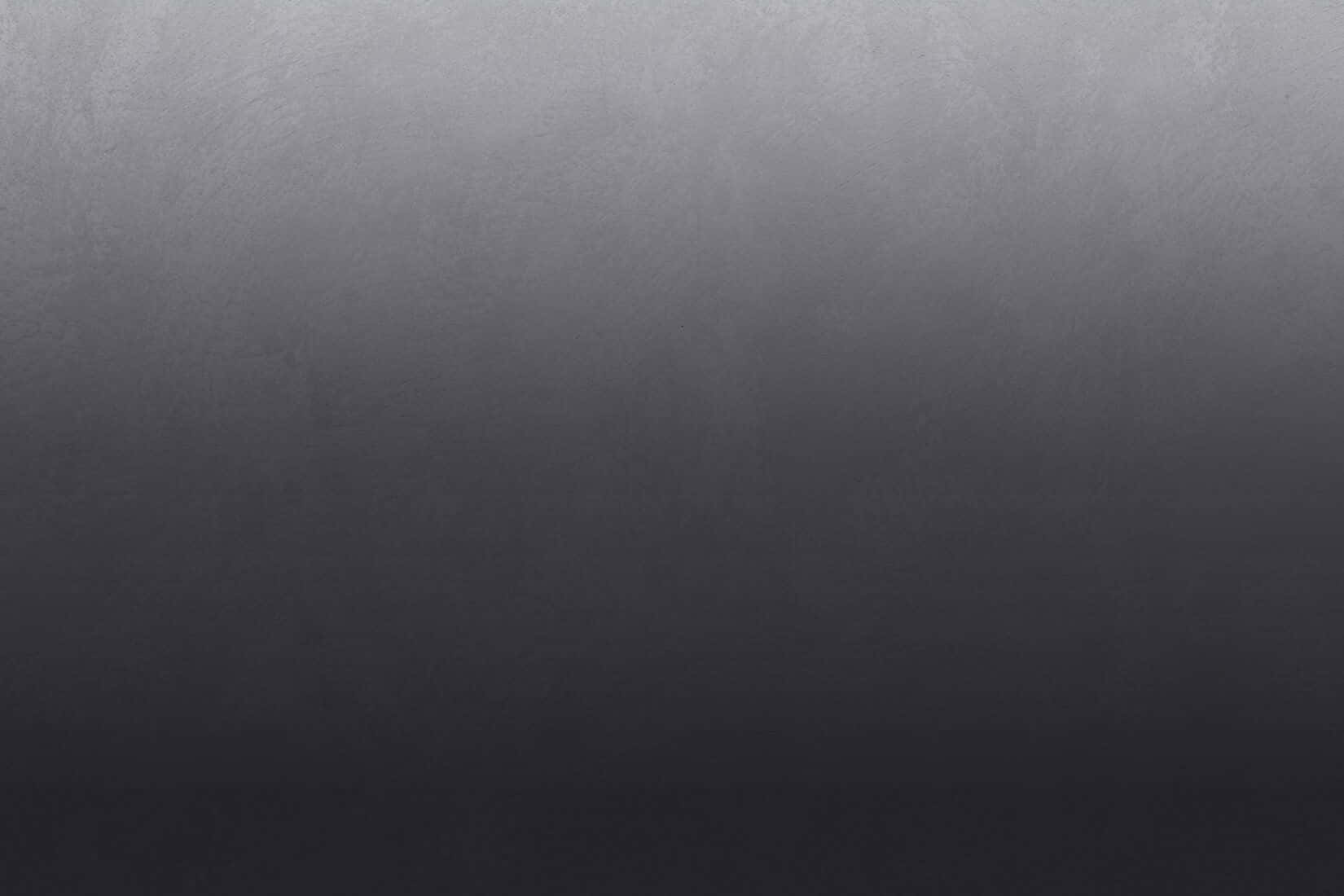 Black Ombre 桌布 壁紙 — 從深灰色到黑色的平滑漸變，帶有細微紋理和從上到下逐漸淡出的柔和光線。