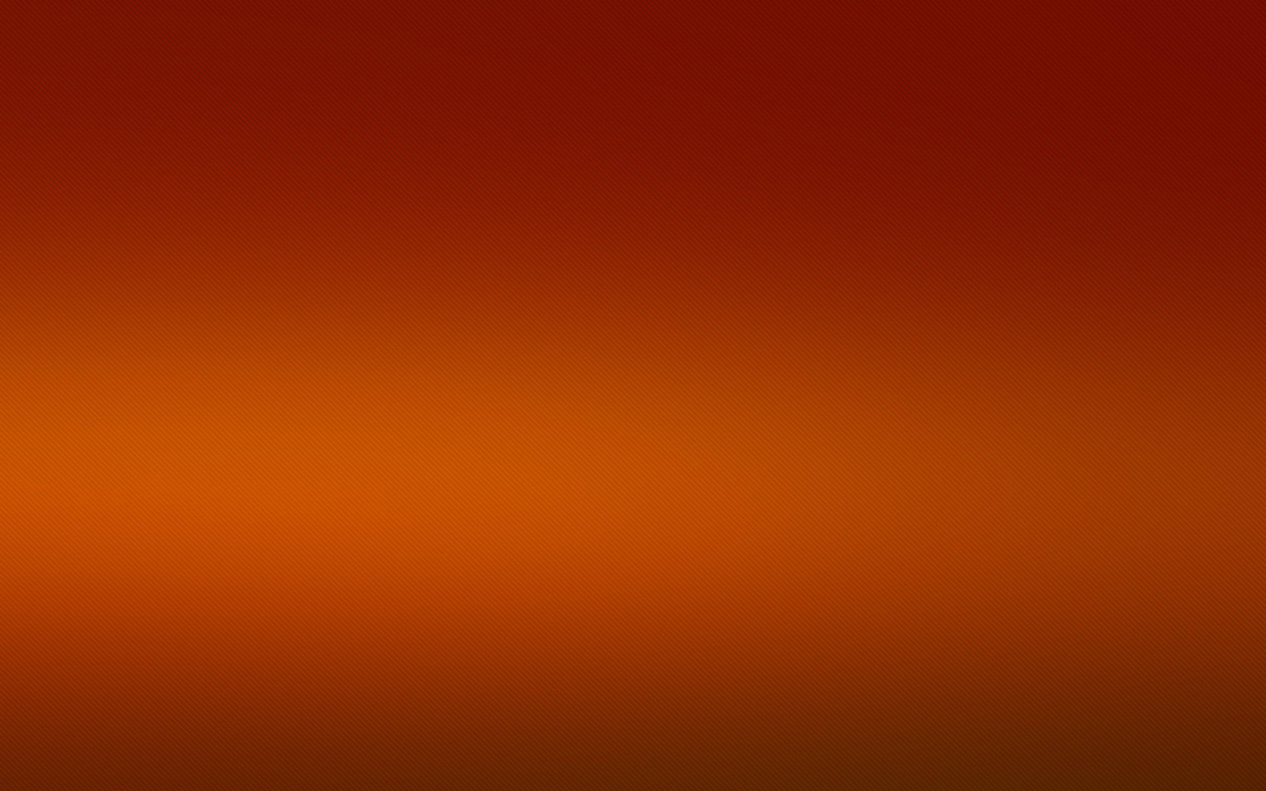 Solid Orange 桌布 壁紙 — 從深紅色到暖橙色的平滑漸變，整個畫面帶有微妙的點狀圖案。