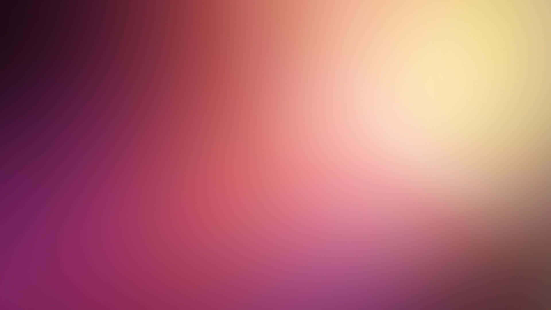Faded 桌布 壁紙 — 從深紫色到暖黃色的平滑漸變，營造出柔和發光的抽象背景。
