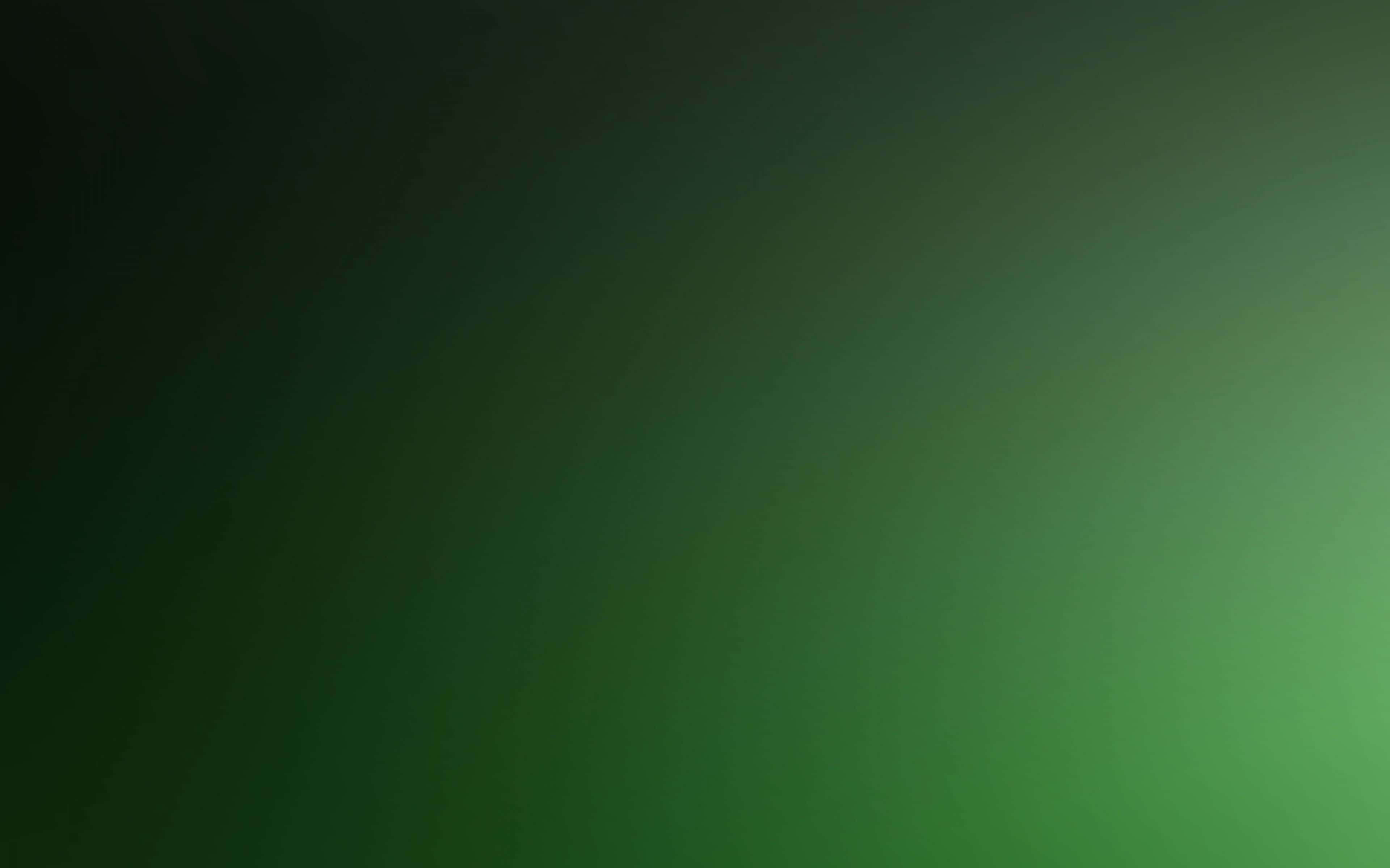 Green Gradient 桌布 壁紙 — 從深綠到亮綠的平滑漸變，帶有柔和的放射狀照明。