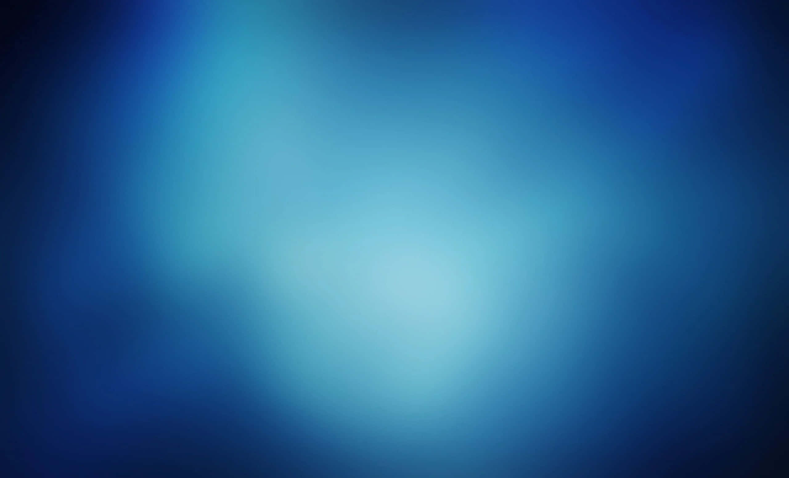 Gradient Blue 桌布 壁紙 — 從深藍到淺藍的柔和漸變，帶有發光的中心，營造出寧靜的抽象背景。