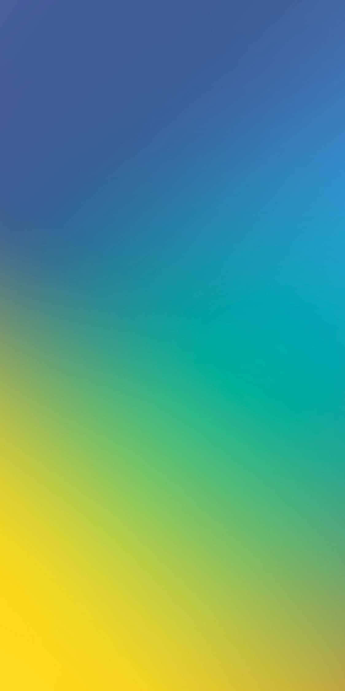 Yellow Gradient 桌布 壁紙 — 從深藍色過渡到鮮黃色的平滑漸變壁紙，帶有柔和的對角筆觸紋理。