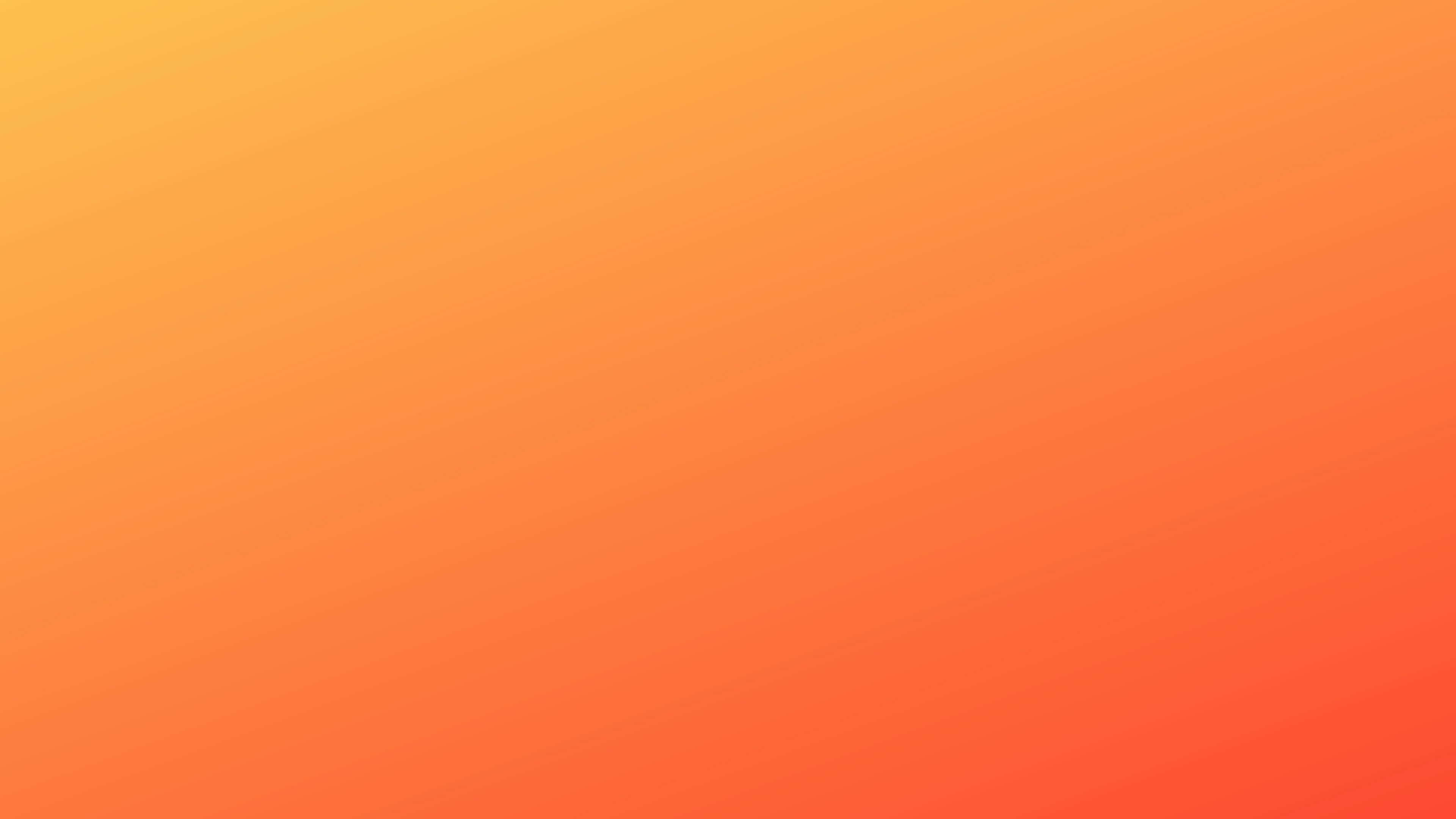 Orange Gradient 桌布 壁紙 — 從溫暖黃色到深橙色的平滑漸變，營造出舒緩的抽象背景。