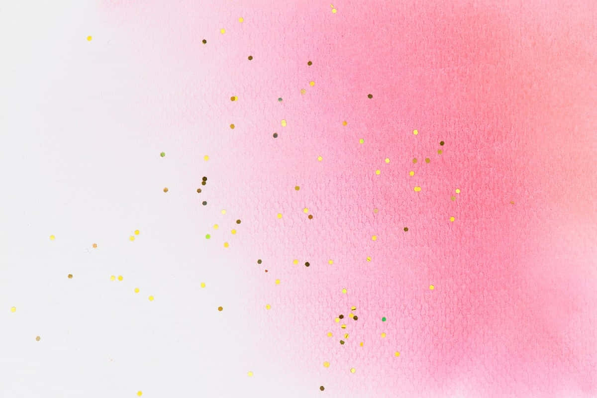 Pink Watercolor 桌布 壁紙 — 從白色到粉紅色的柔和水彩漸變，在紋理紙上散落著金色和棕色的閃粉顆粒。