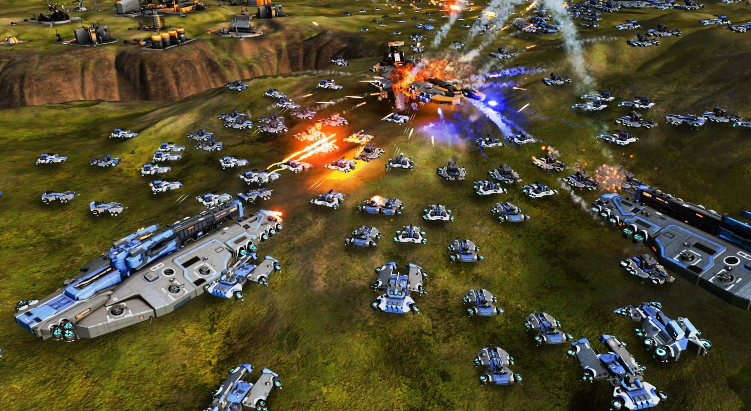 1440p Ashes Of The Singularity Escalation 桌布 壁紙 — 從空中俯瞰，未來主義的裝甲車輛和軍艦在草地上進行激烈戰鬥，伴隨著爆炸和能量光束。