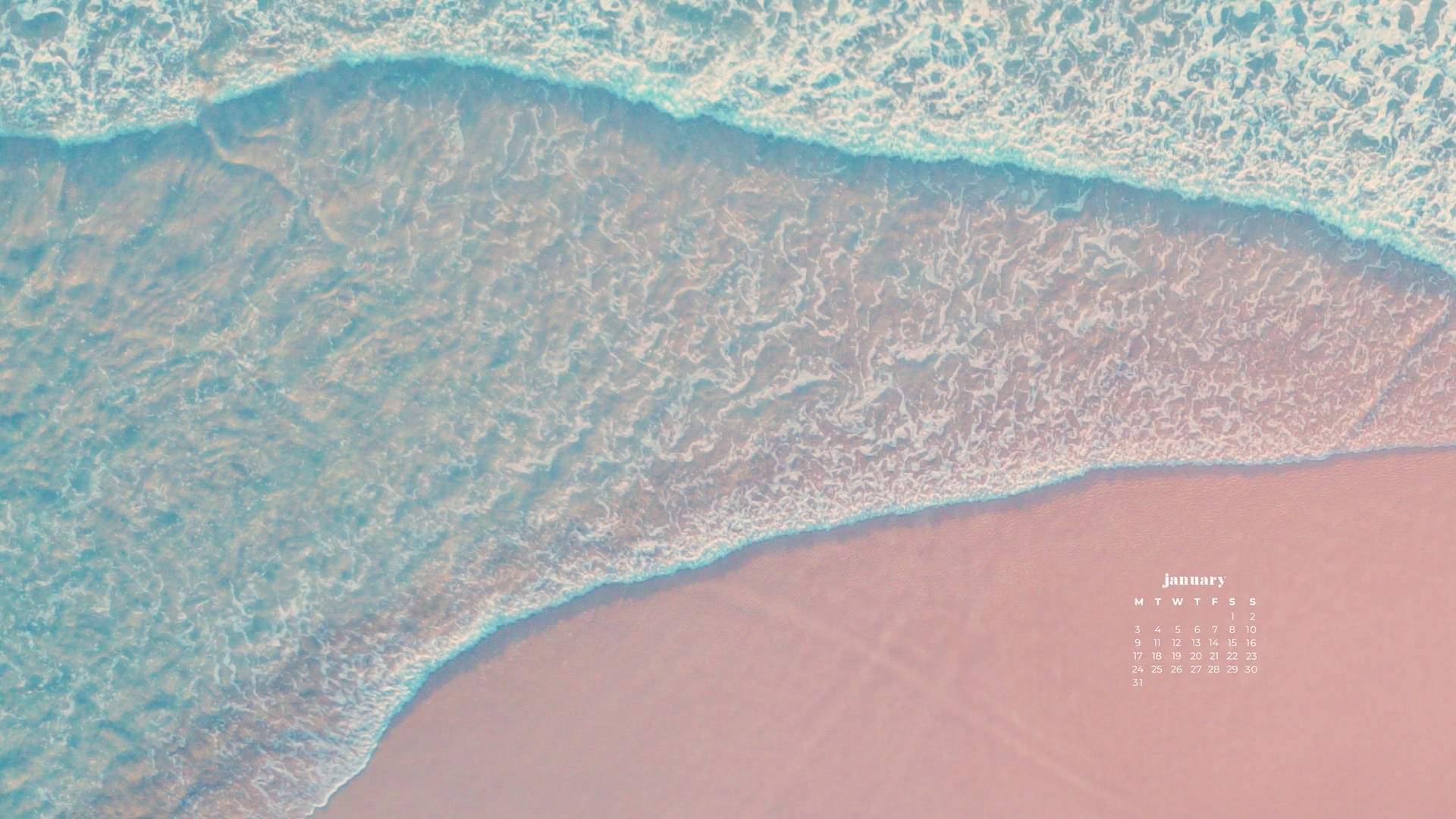 從空中俯瞰，碧綠的海浪與粉紅色沙灘相遇，附有1月日曆。 — 一月 GIF 壁紙