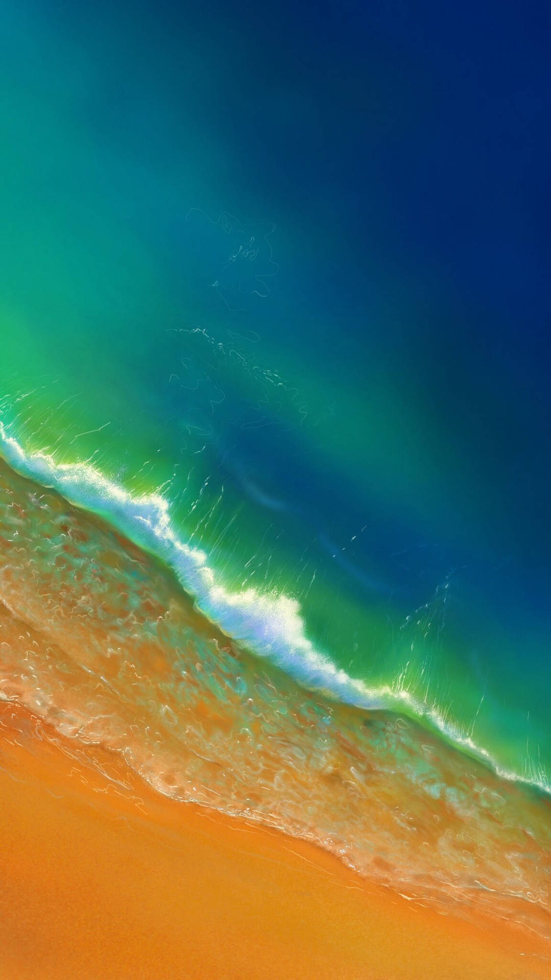綠松石色的海浪與金色沙灘交匯，形成充滿活力的海岸景觀。 — iPhone 14 壁紙