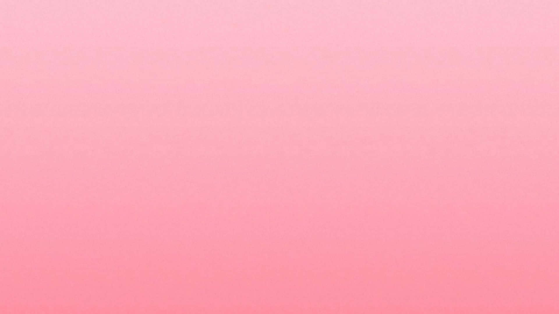 Plain Pink Desktop 桌布 壁紙 — 從粉彩粉紅色到珊瑚粉紅色的柔和漸變，整個畫面帶有微妙的紋理。